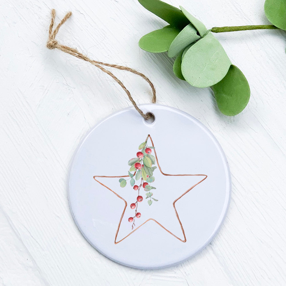 A beautifully crafted porcelain Christmas Star ornament with berries design, showcasing vibrant colors and a smooth gloss finish.