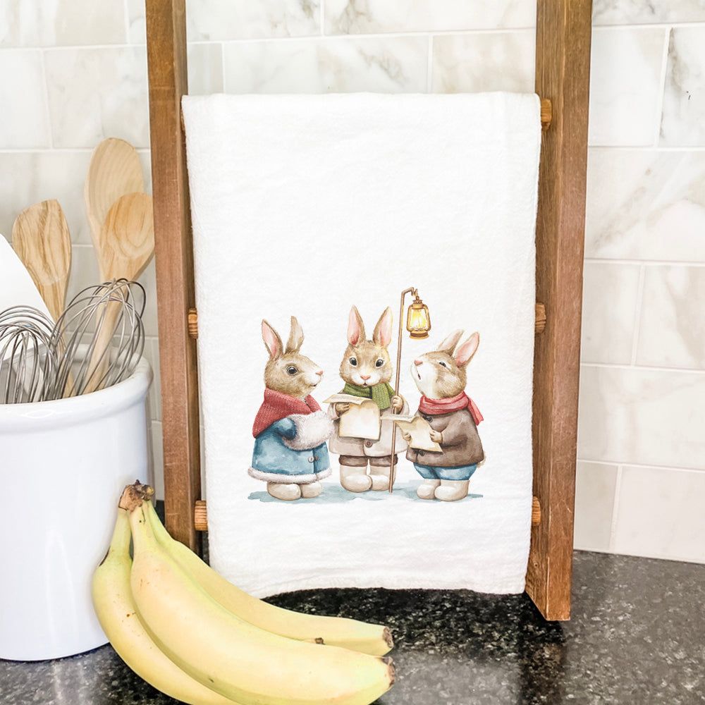 Fairytale Bunny Carolers cotton tea towel featuring vibrant colors and charming bunny design, perfect for kitchen use.