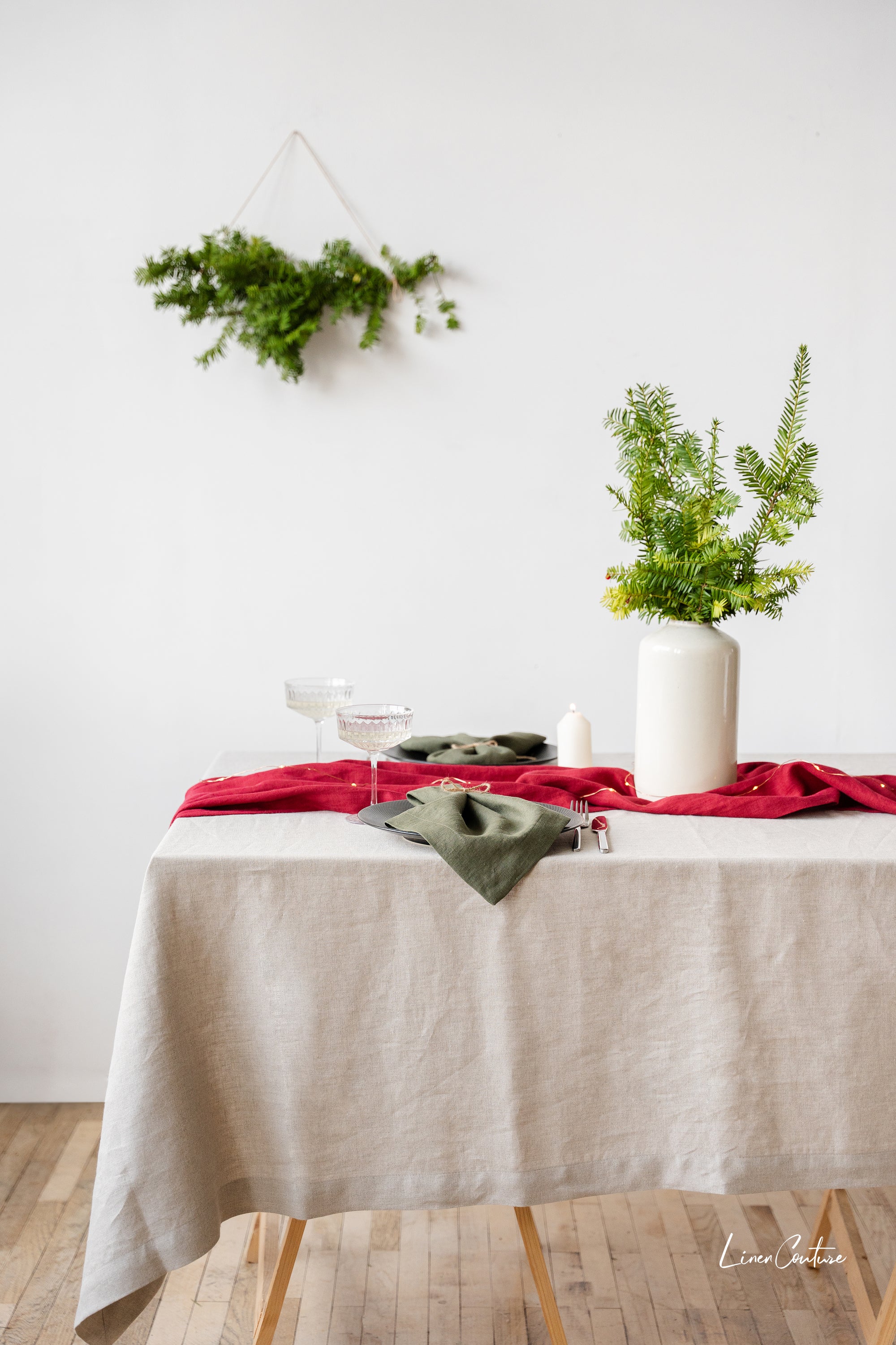Handmade Natural Linen Christmas Tablecloth elegantly draped on a dining table, showcasing its premium texture and festive appeal.