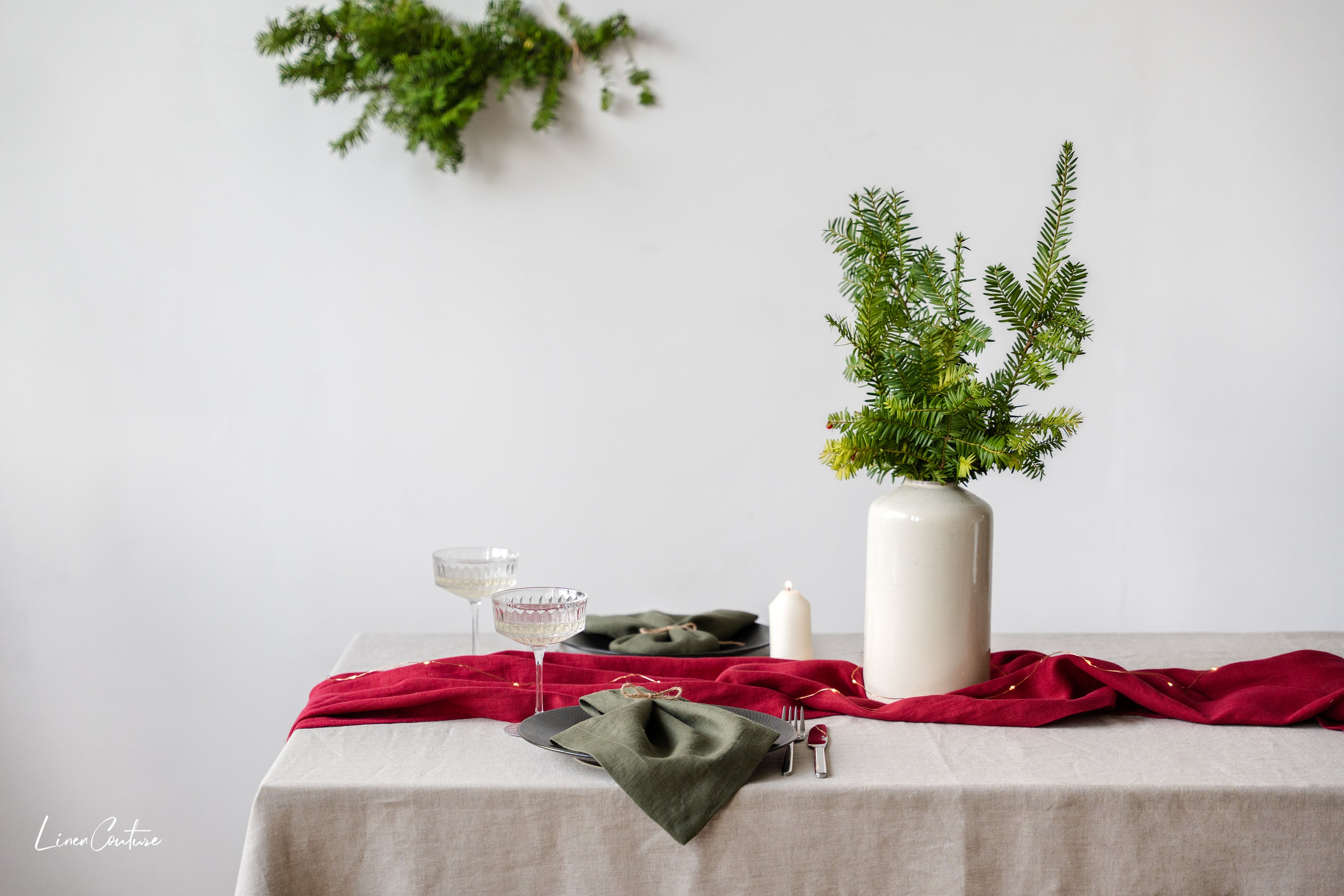Handmade Natural Linen Christmas Tablecloth elegantly draped on a dining table, showcasing its premium texture and festive appeal.