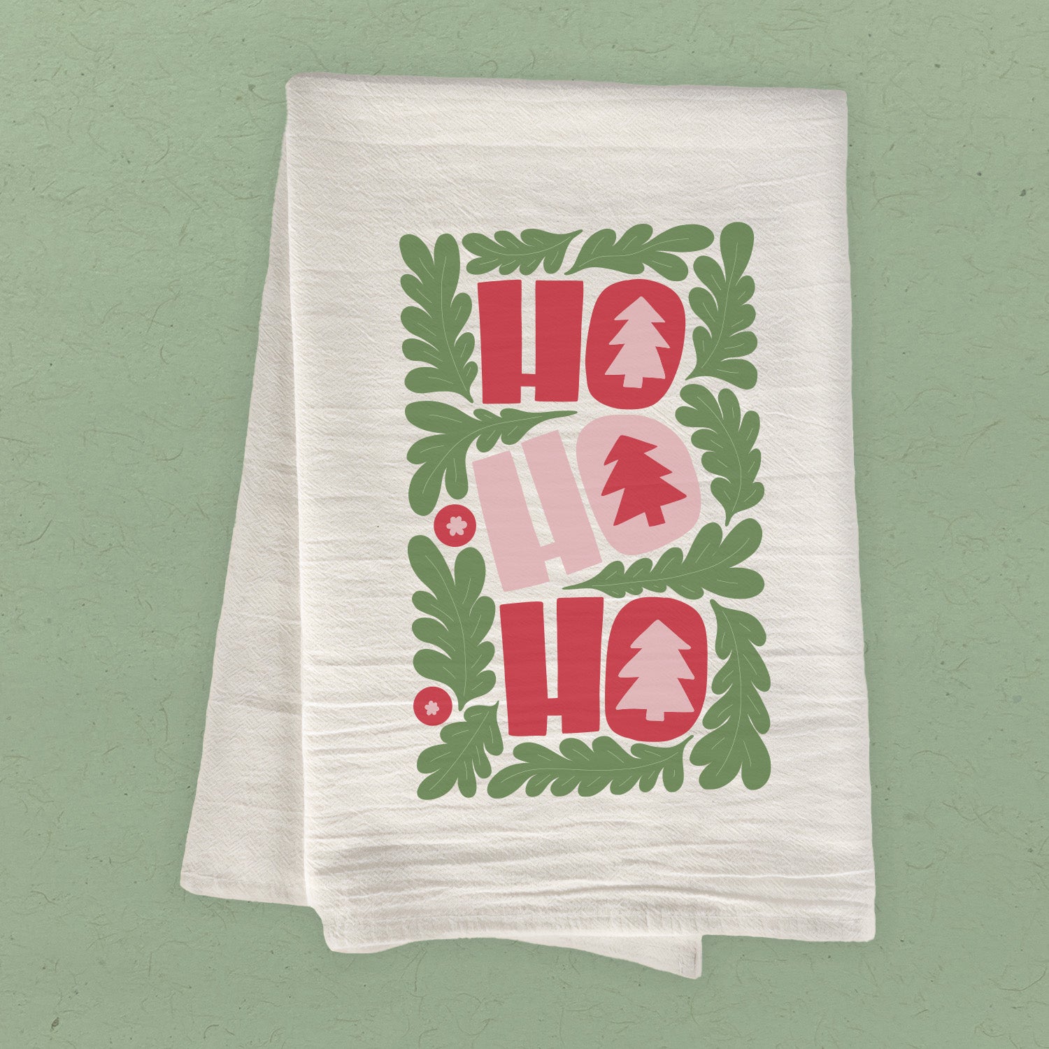 A festive Ho Ho Ho Cotton Tea Towel featuring vibrant holiday-themed design, made from 100% absorbent cotton.