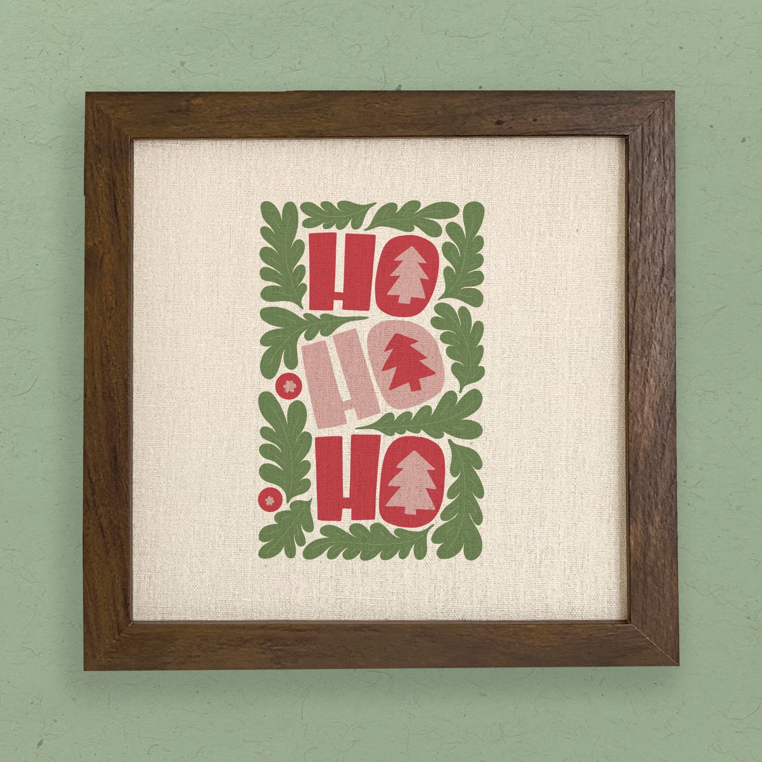 A charming Ho Ho Ho framed sign with a stylized wood frame, featuring eco-friendly printing on a linen-look background, available in walnut and white-washed options.