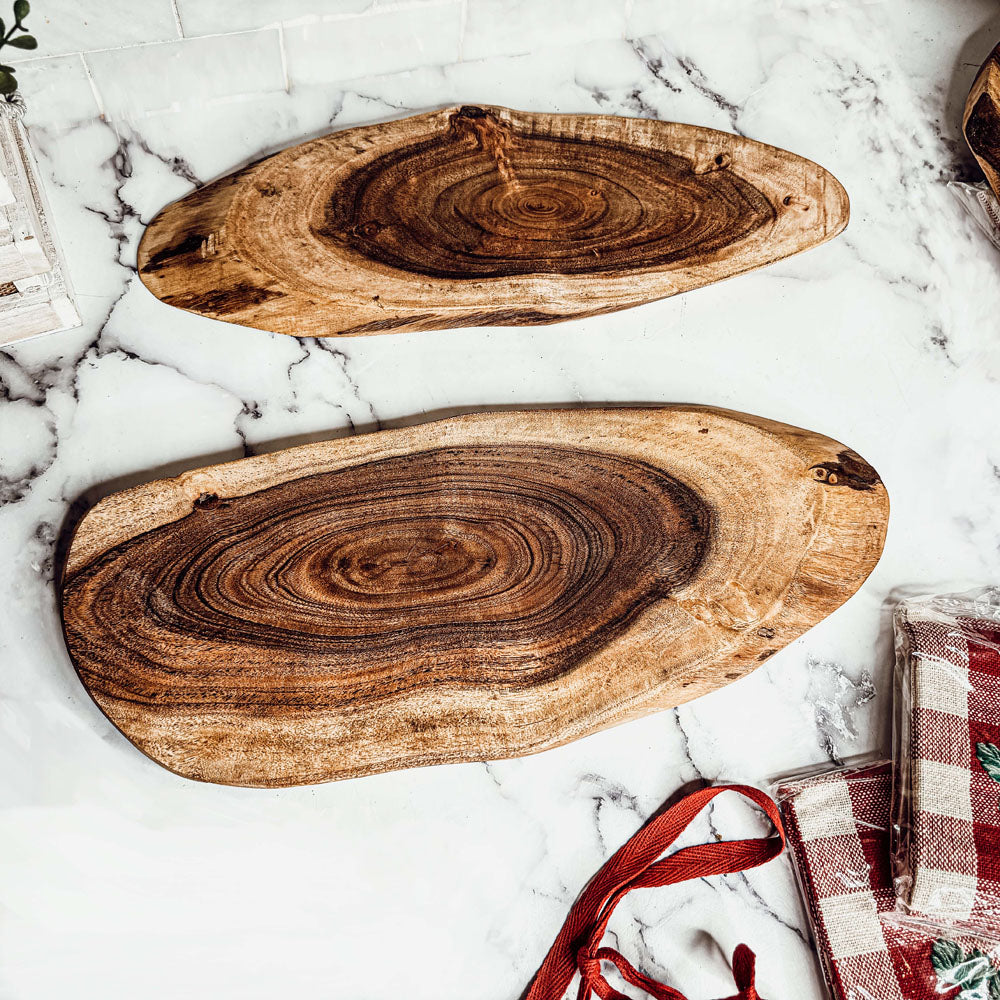 Holiday Charcuterie & Tartan Towel Set featuring a wooden charcuterie board and a tartan print kitchen towel in red and green.