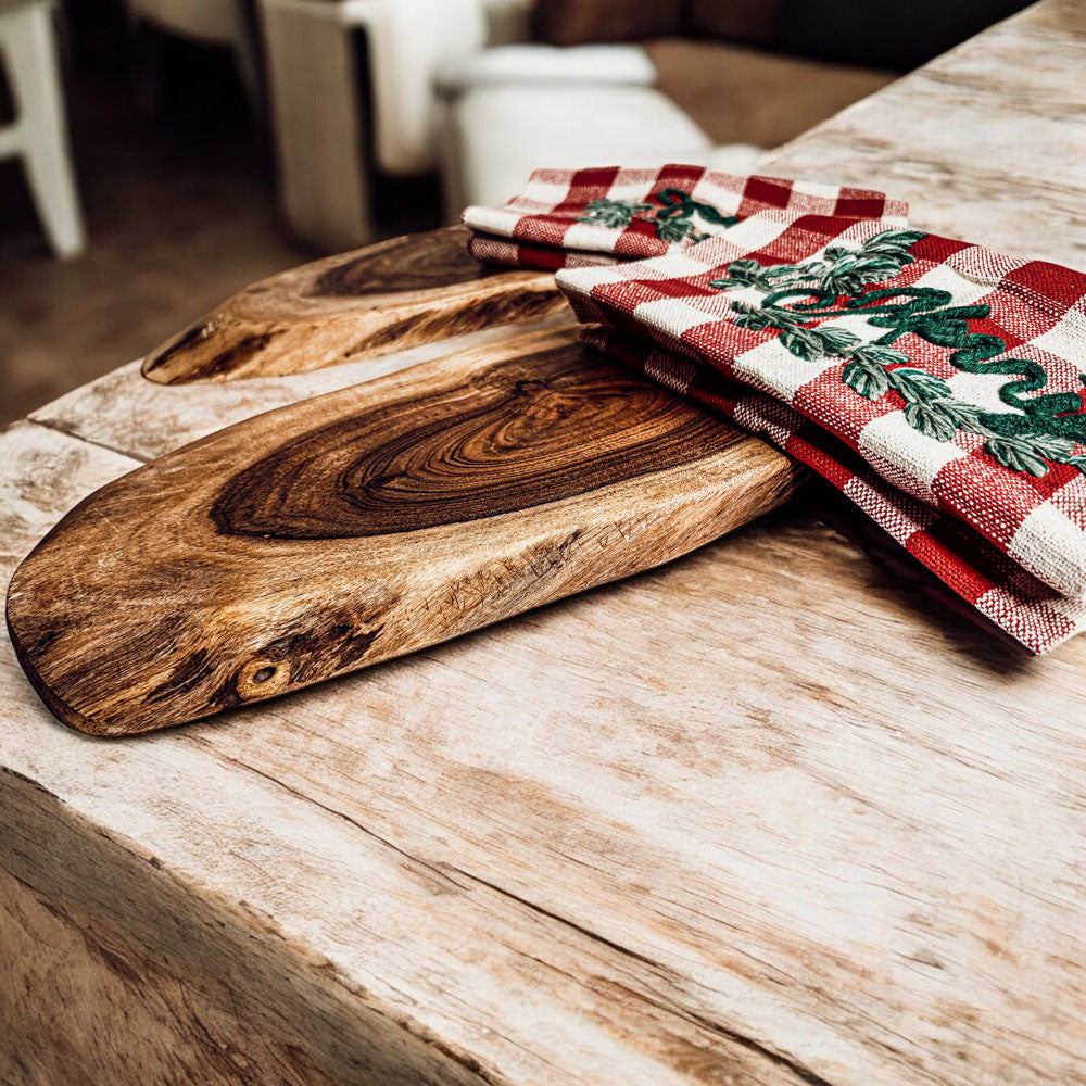 Holiday Charcuterie & Tartan Towel Set featuring a wooden charcuterie board and a tartan print kitchen towel in red and green.