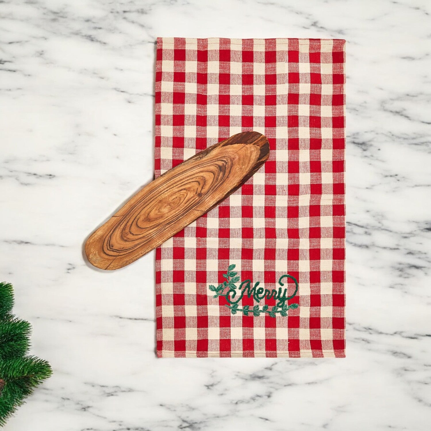 Holiday Charcuterie & Tartan Towel Set featuring a wooden charcuterie board and a tartan print kitchen towel in red and green.