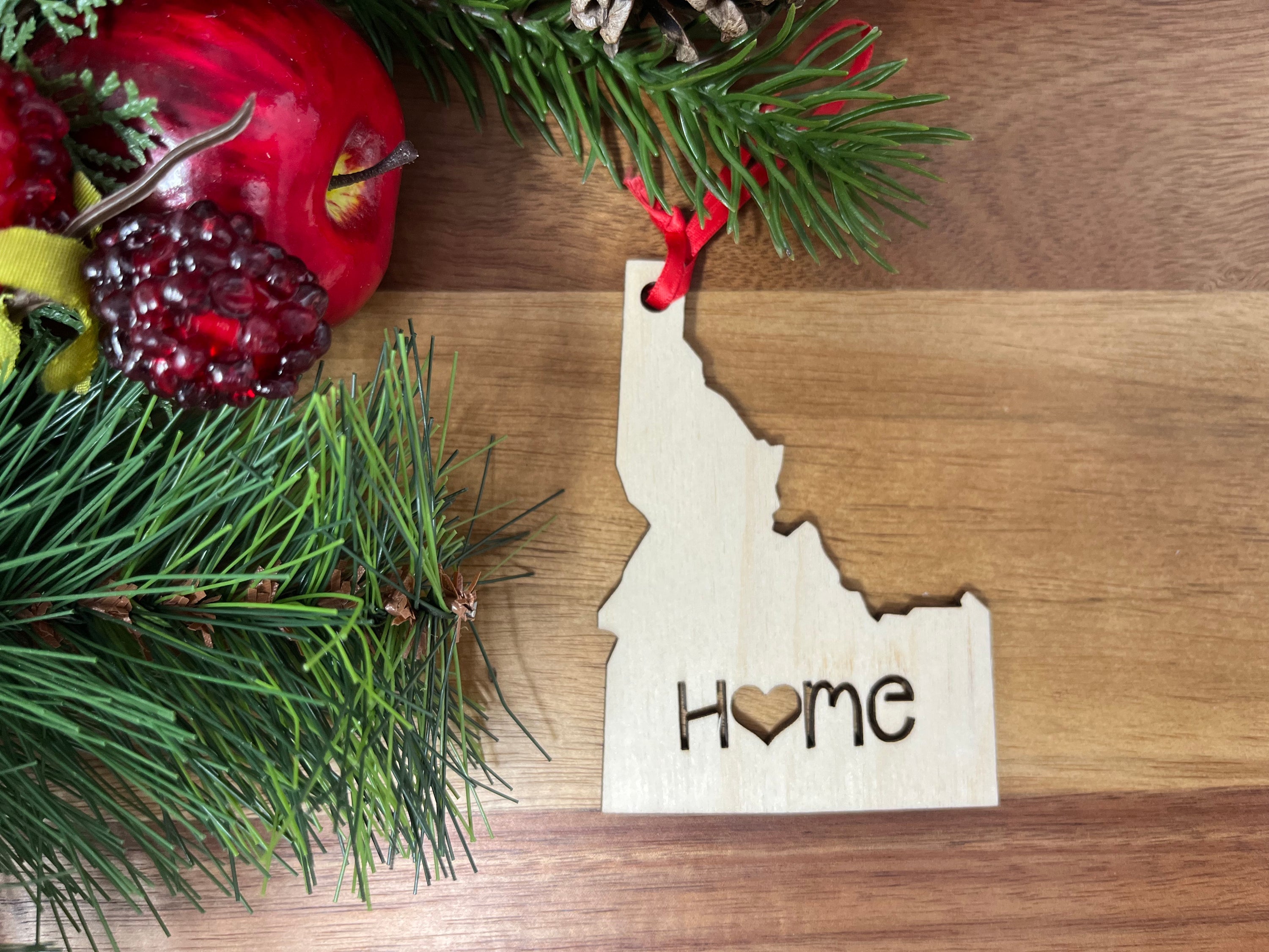 Idaho State Wood Christmas Ornament featuring 'Home' design, crafted from premium Baltic Birch wood.