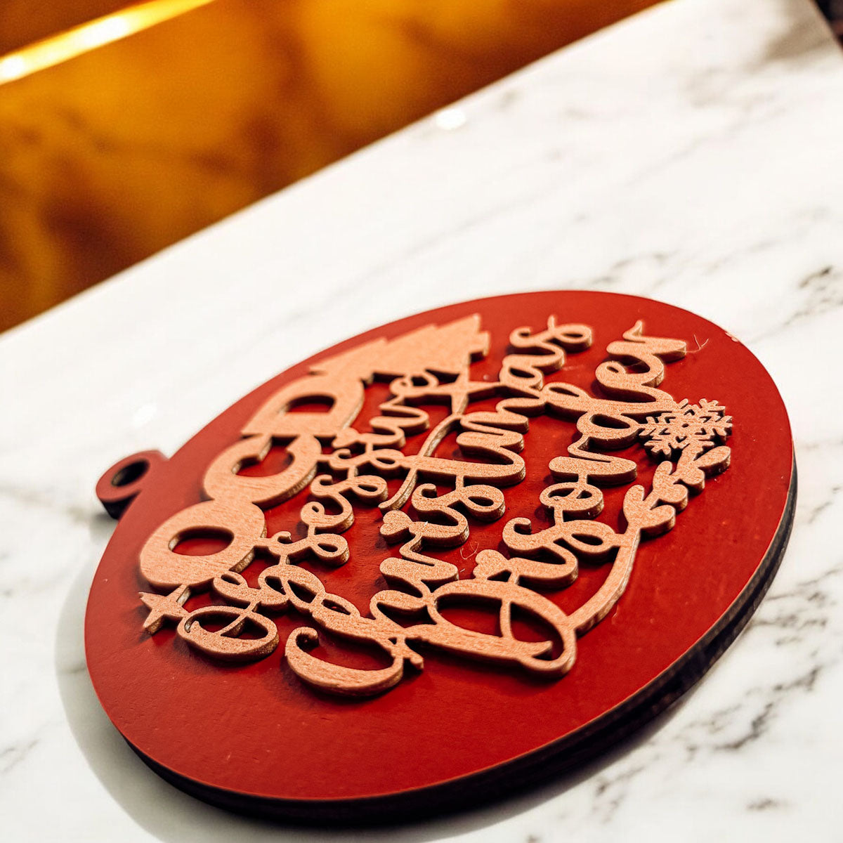 Handcrafted 3D Wooden Christmas Ornaments in various colors, showcasing unique designs and rustic jute twine for hanging.