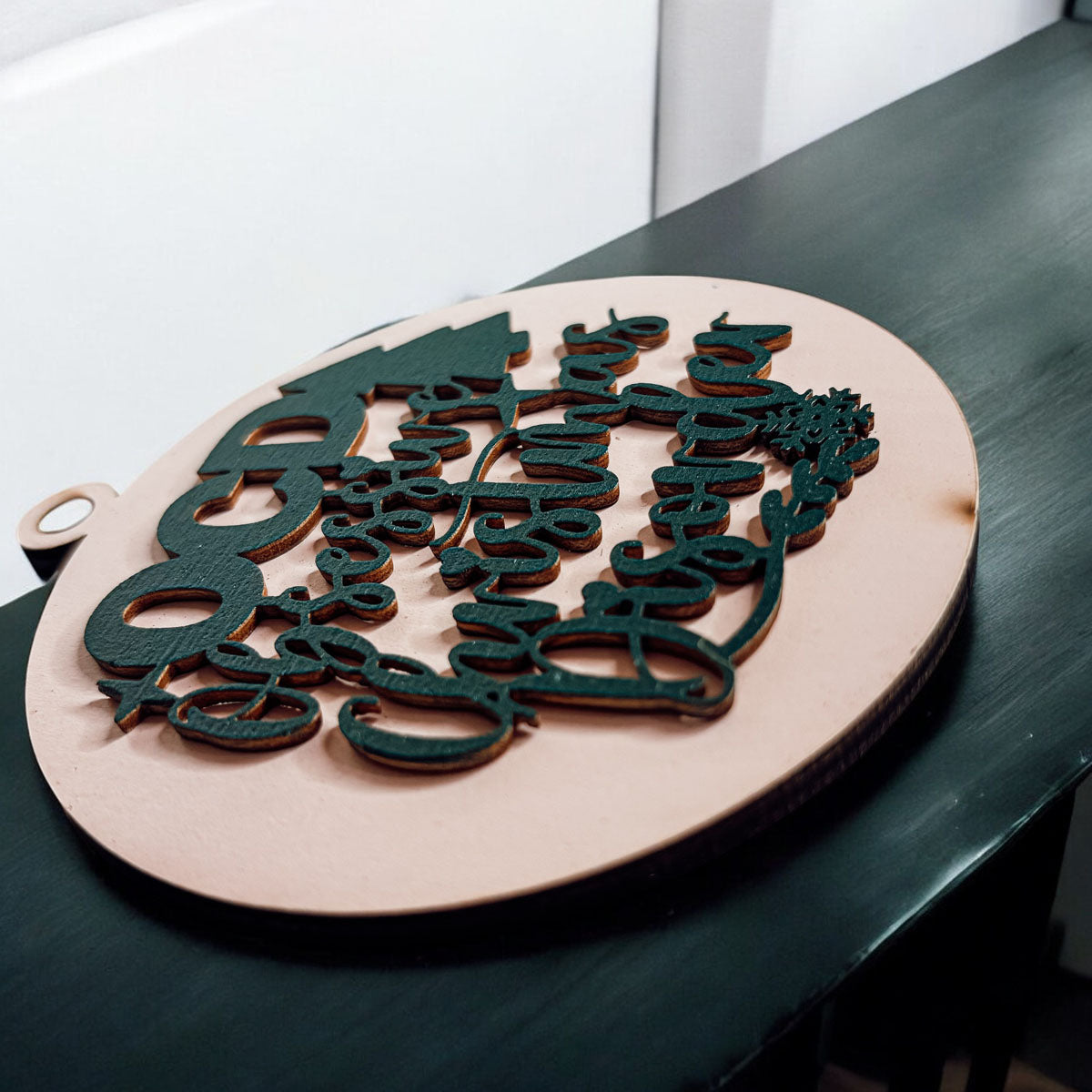 Handcrafted 3D Wooden Christmas Ornaments in various colors, showcasing unique designs and rustic jute twine for hanging.