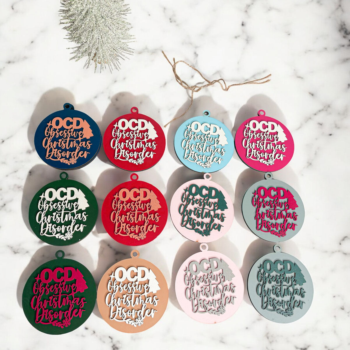 Handcrafted 3D Wooden Christmas Ornaments in various colors, showcasing unique designs and rustic jute twine for hanging.