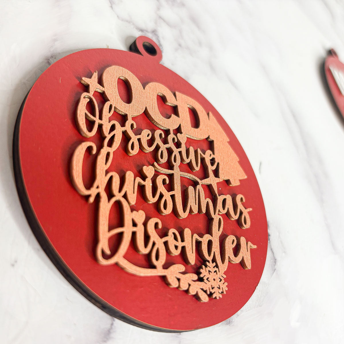 Handcrafted 3D Wooden Christmas Ornaments in various colors, showcasing unique designs and rustic jute twine for hanging.