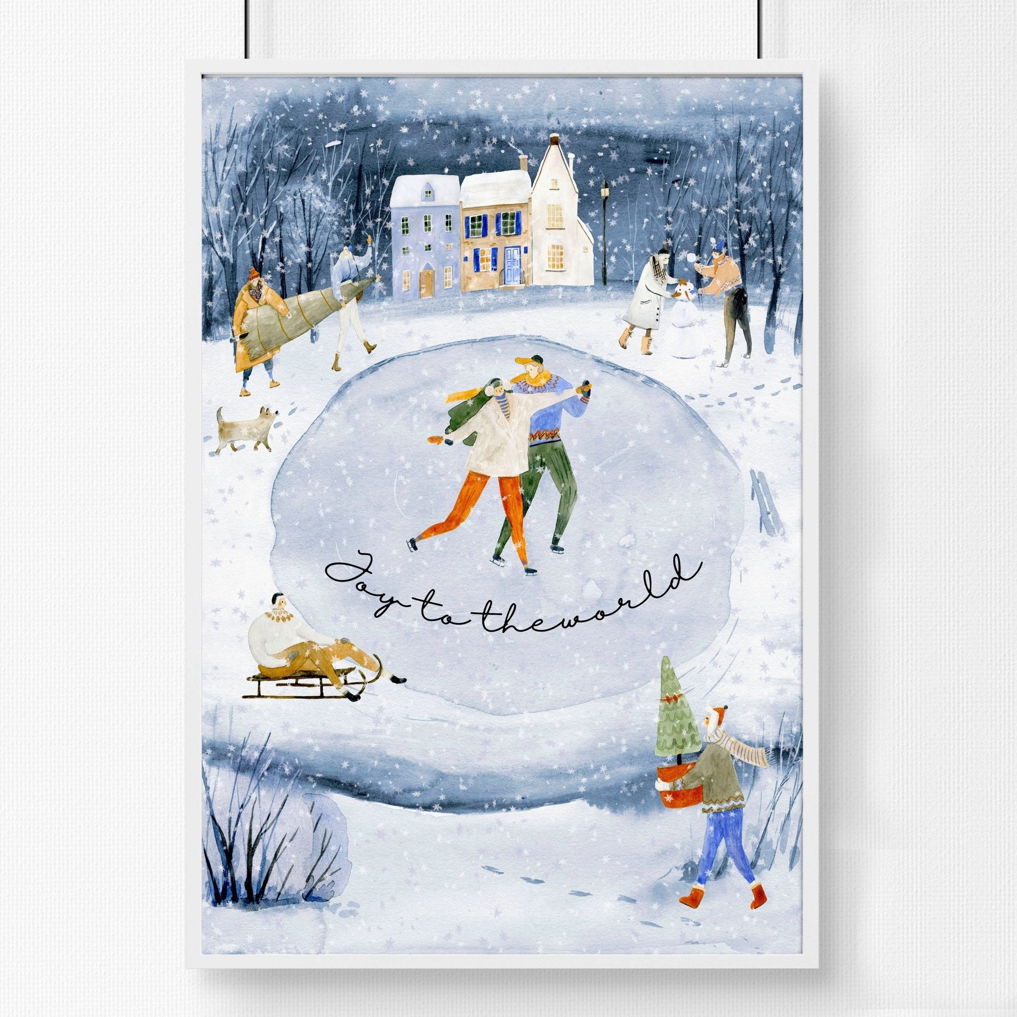A beautiful indoor Christmas wall art print featuring a serene blue watercolour landscape with a snowy pond and a charming village adorned with lights.