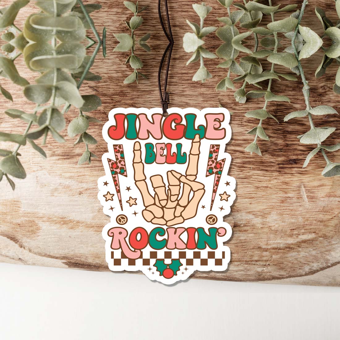 Jingle Bell Freshie hanging air freshener with festive design, perfect for holiday decor and freshening up spaces.