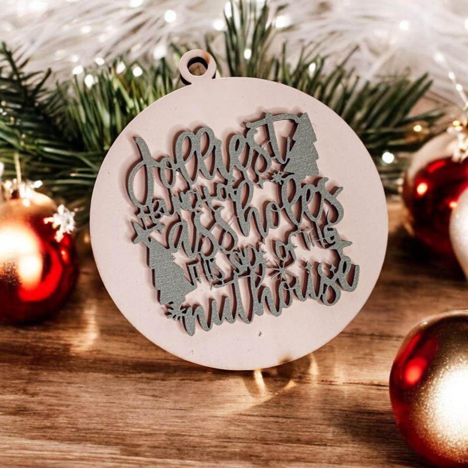 Jolliest Bunch Wooden Ornament featuring festive graphics and rustic twine, available in 12 vibrant colors.