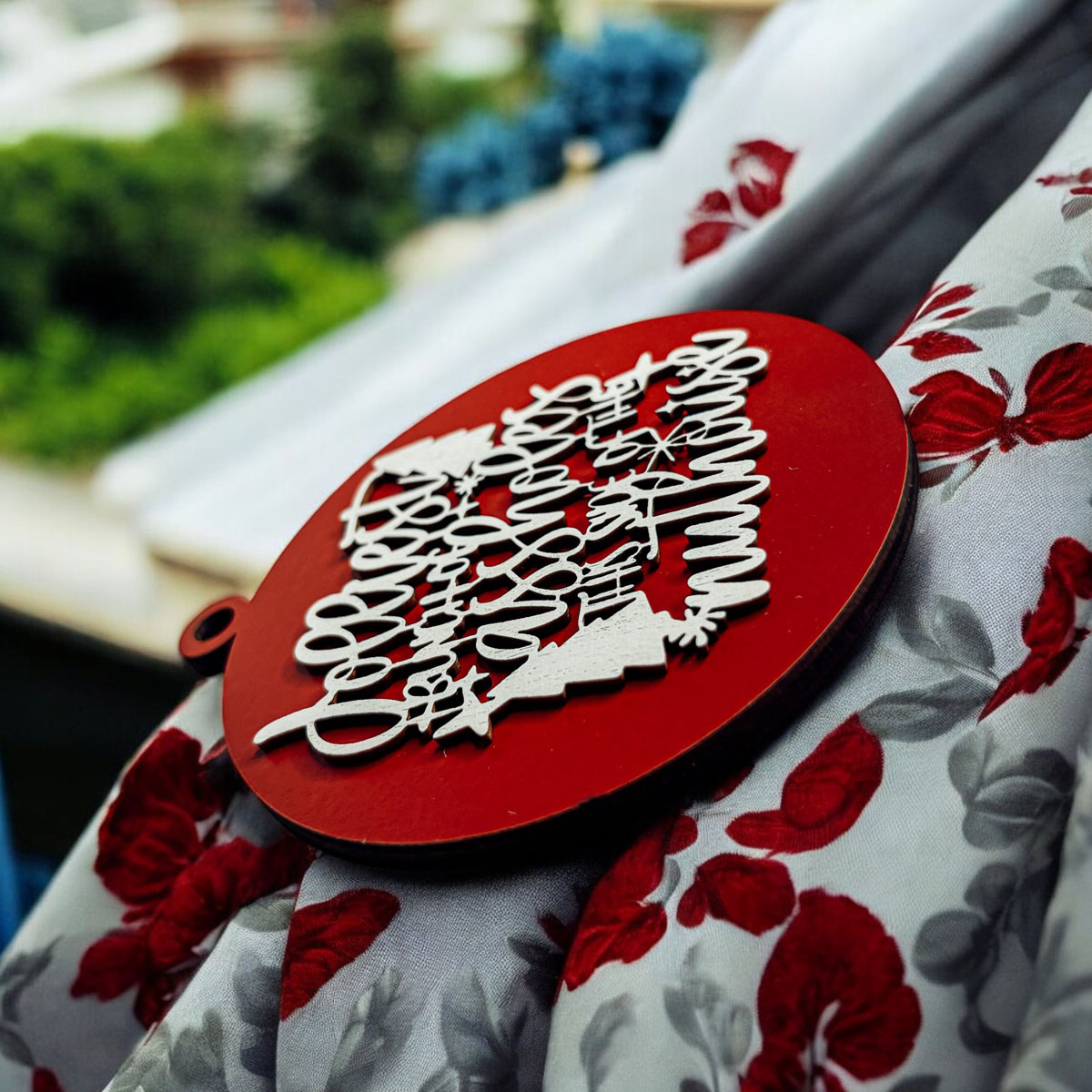 Jolliest Bunch Wooden Ornament featuring festive graphics and rustic twine, available in 12 vibrant colors.