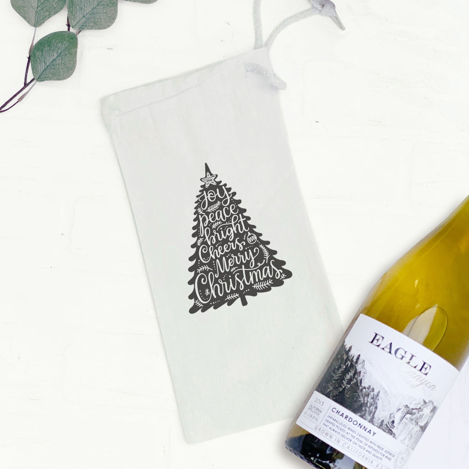 Joy Christmas Tree canvas wine bag featuring a festive design, perfect for holiday gifting.