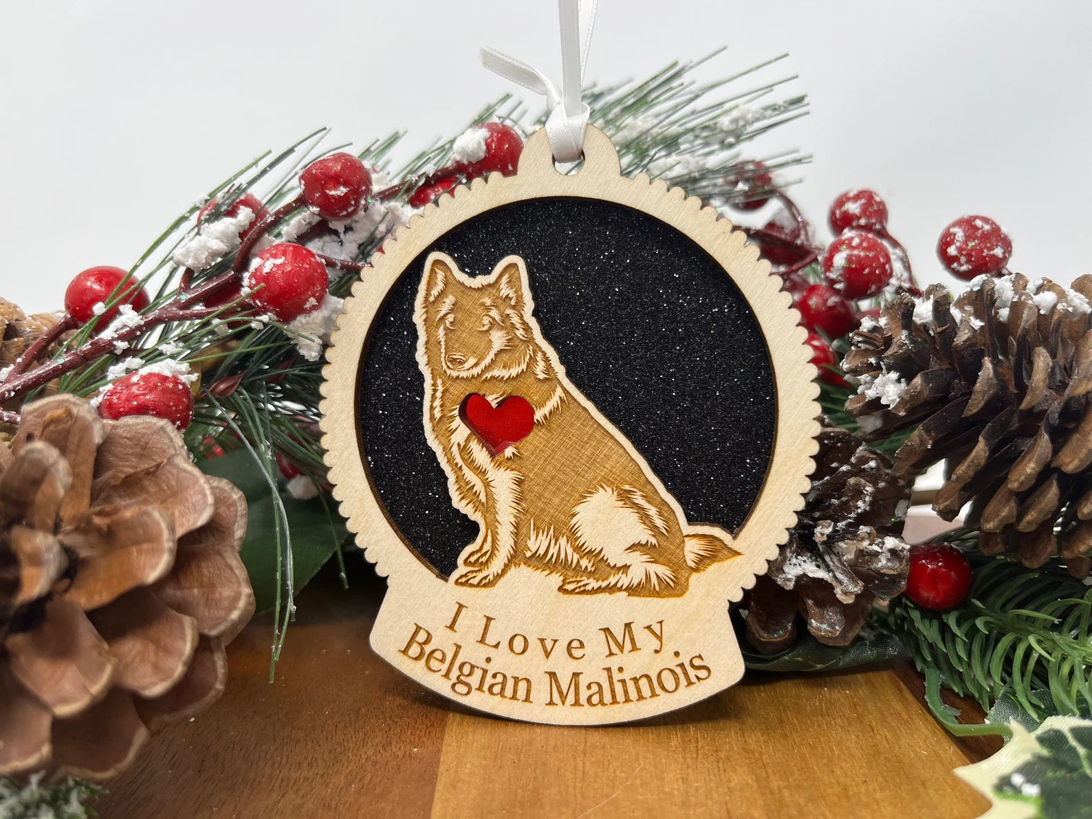 Beautiful laser-cut wooden ornament featuring a Belgian Malinois silhouette, perfect for holiday decor.