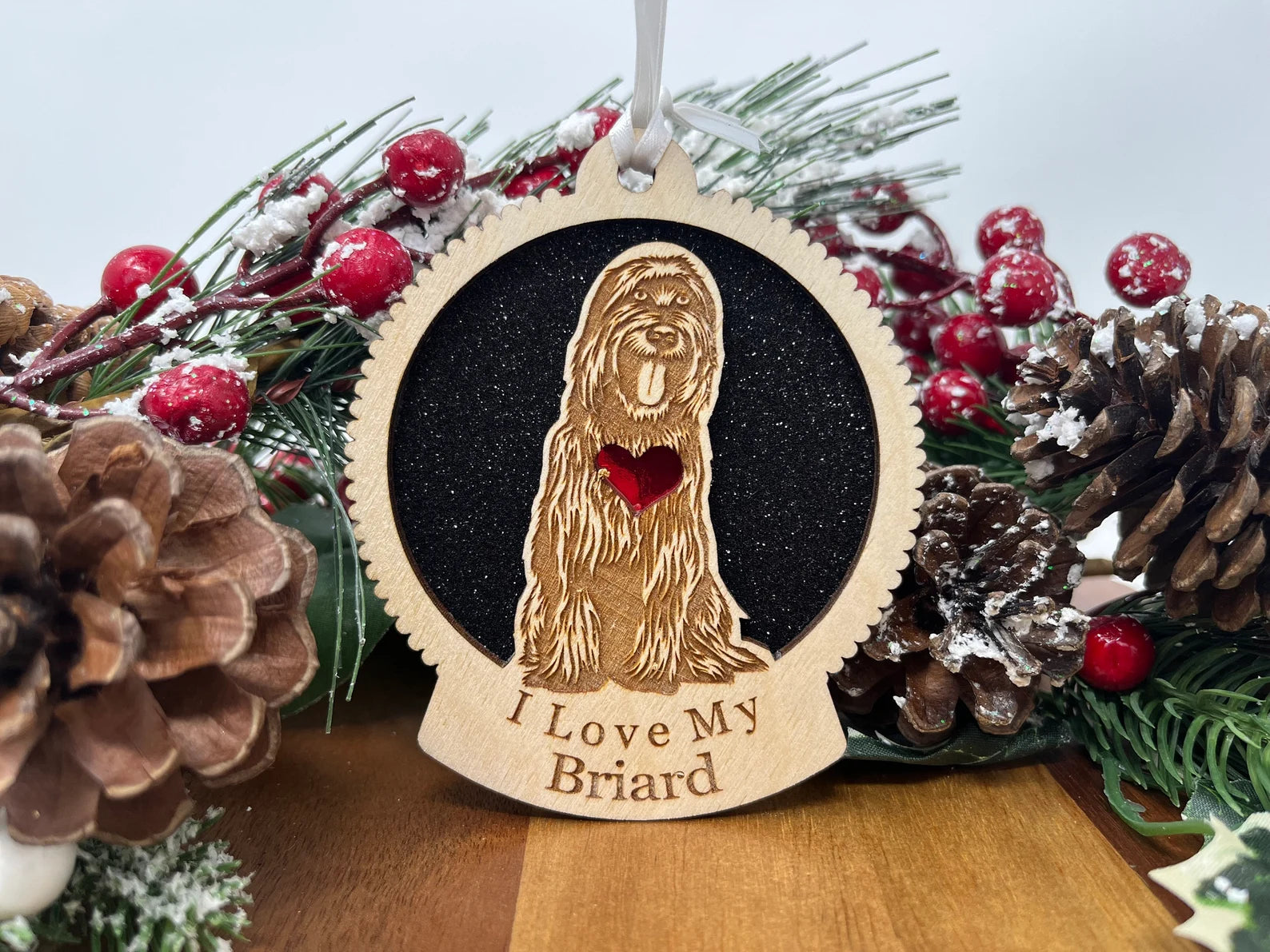 A beautifully crafted Love My Briard ornament made from laser-cut Baltic Birch wood, featuring a silhouette of a Briard dog, perfect for Christmas decoration.