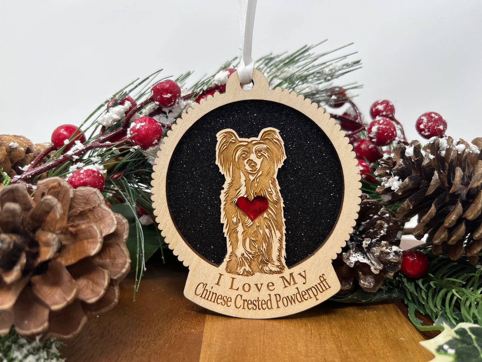 Laser cut wooden ornament featuring a Chinese Crested Powderpuff silhouette, perfect for Christmas decoration.