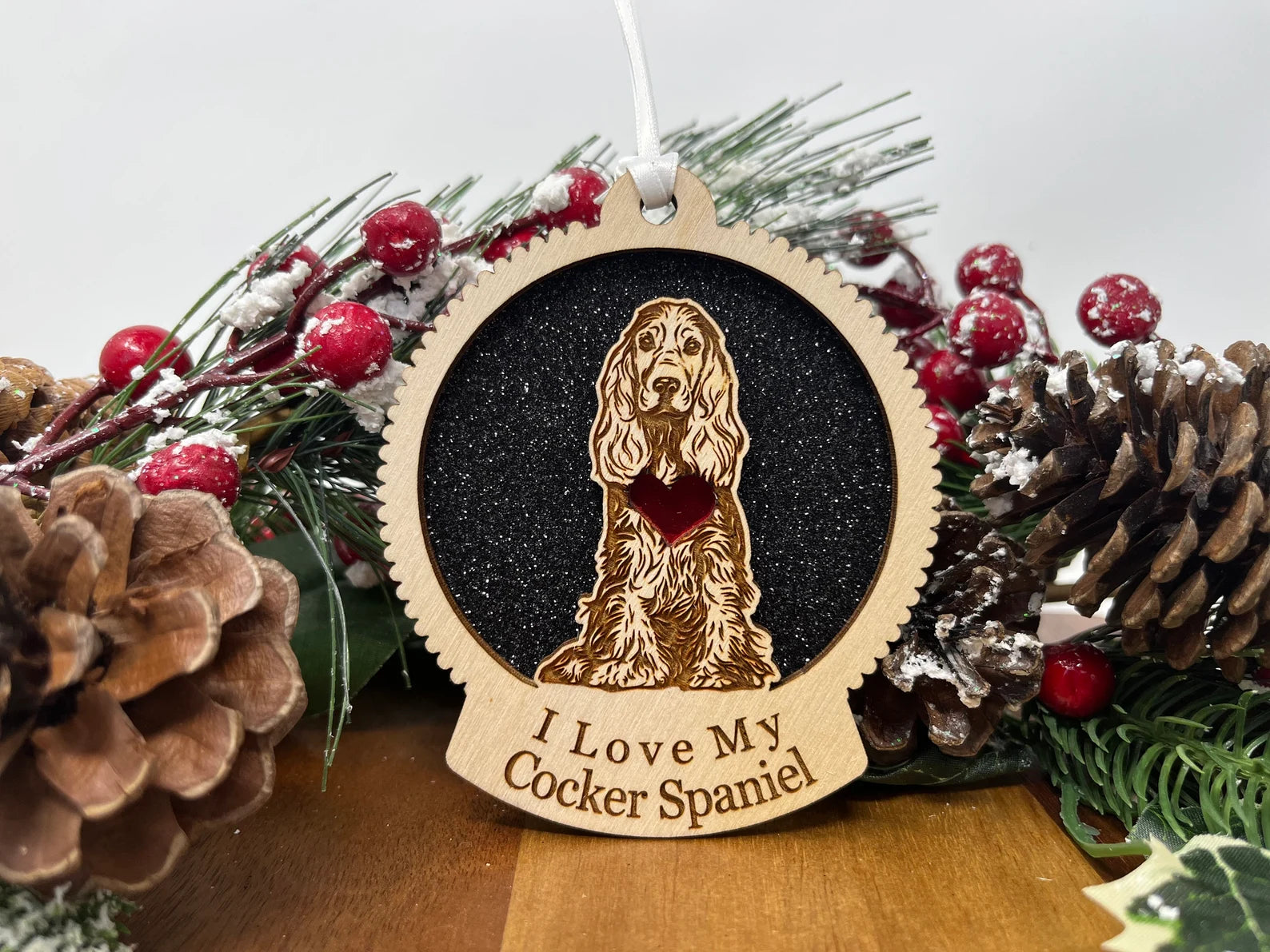 A beautifully crafted wooden ornament featuring a Cocker Spaniel silhouette, perfect for Christmas decorations.
