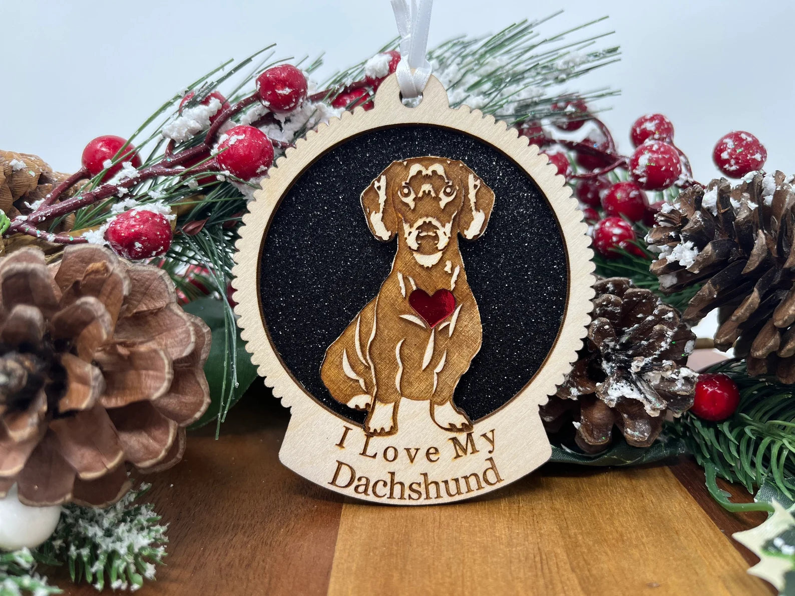 Beautiful laser-cut wooden ornament featuring a dachshund silhouette, perfect for Christmas decoration.
