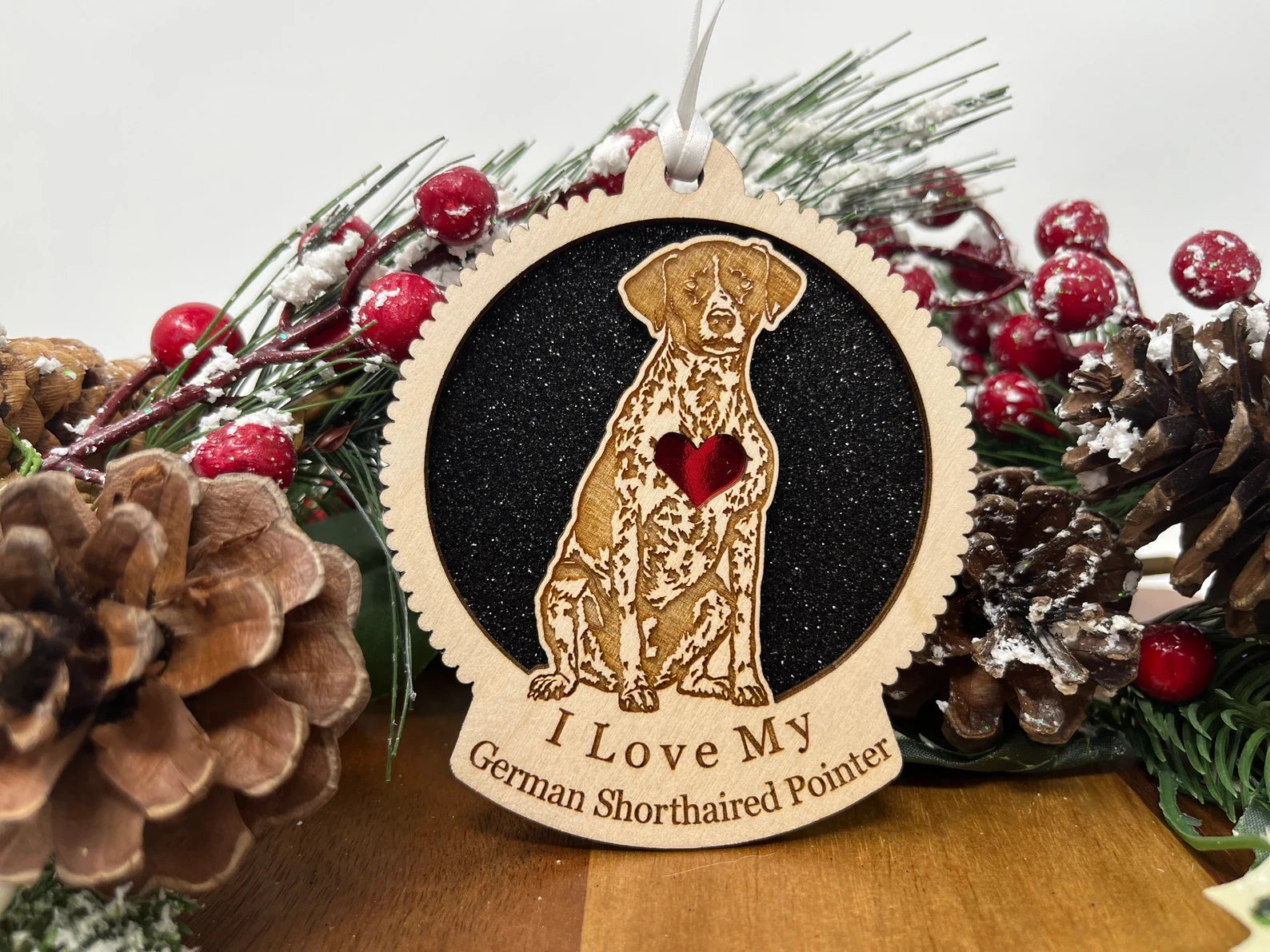Laser cut wooden ornament featuring a German Shorthaired Pointer silhouette, perfect for Christmas decoration.