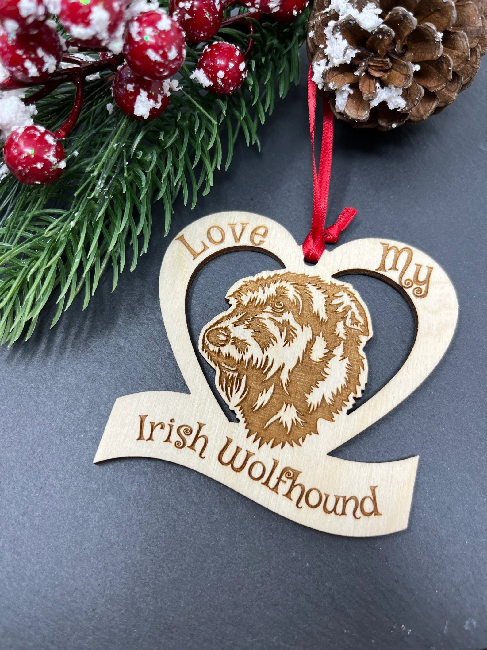 A beautifully laser engraved wooden ornament featuring an Irish Wolfhound, perfect for Christmas decoration.