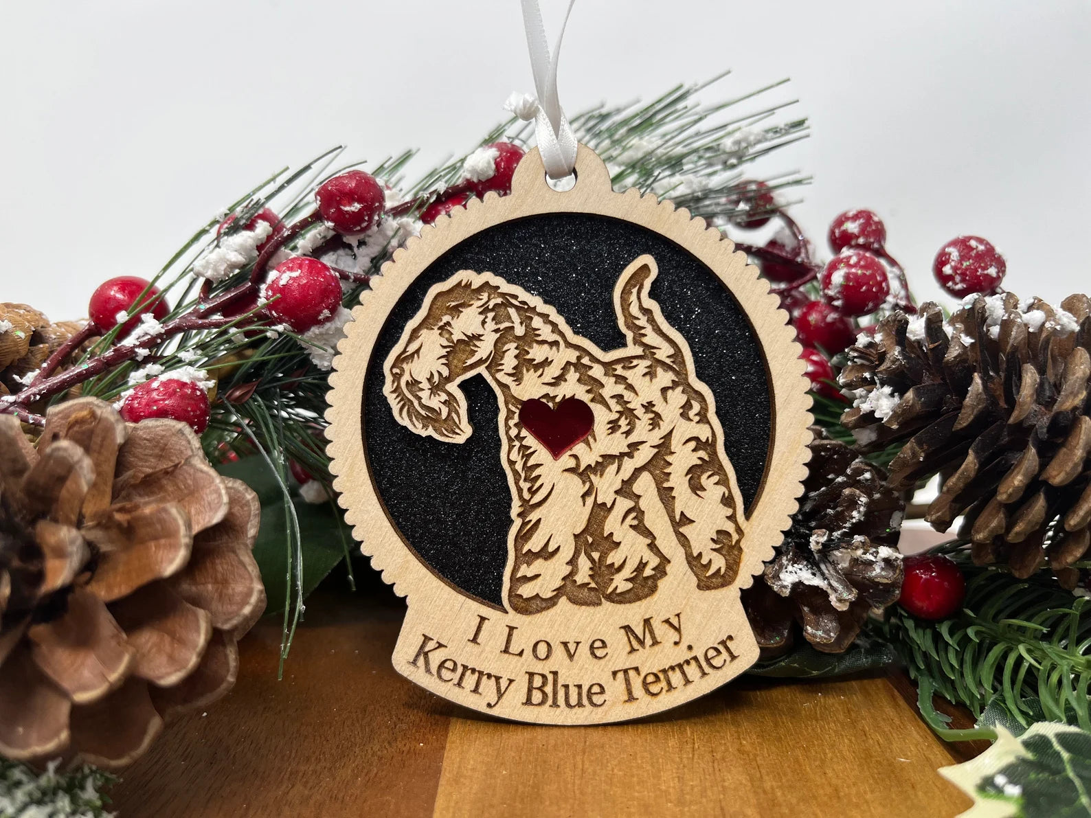 A beautifully crafted laser-cut wooden ornament featuring a Kerry Blue Terrier silhouette, perfect for holiday decor.