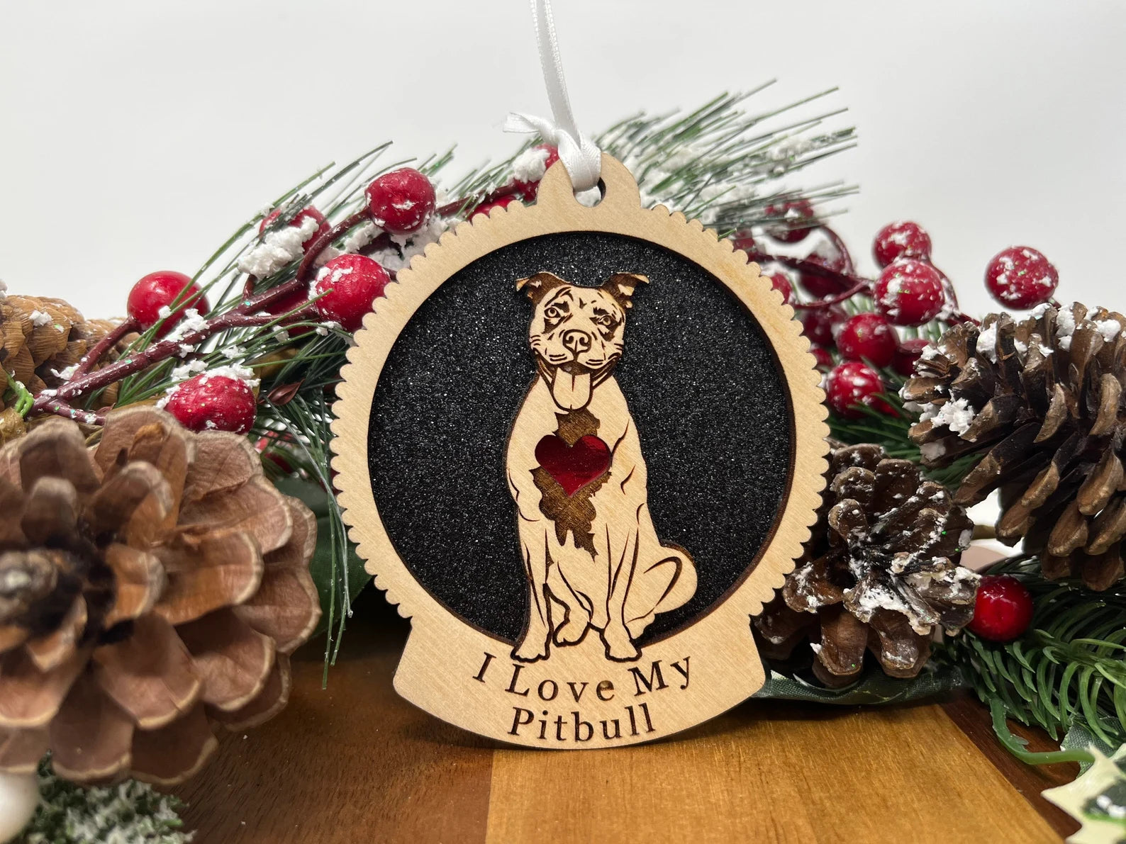 Beautiful laser cut wooden ornament featuring a pitbull silhouette, perfect for Christmas decoration.