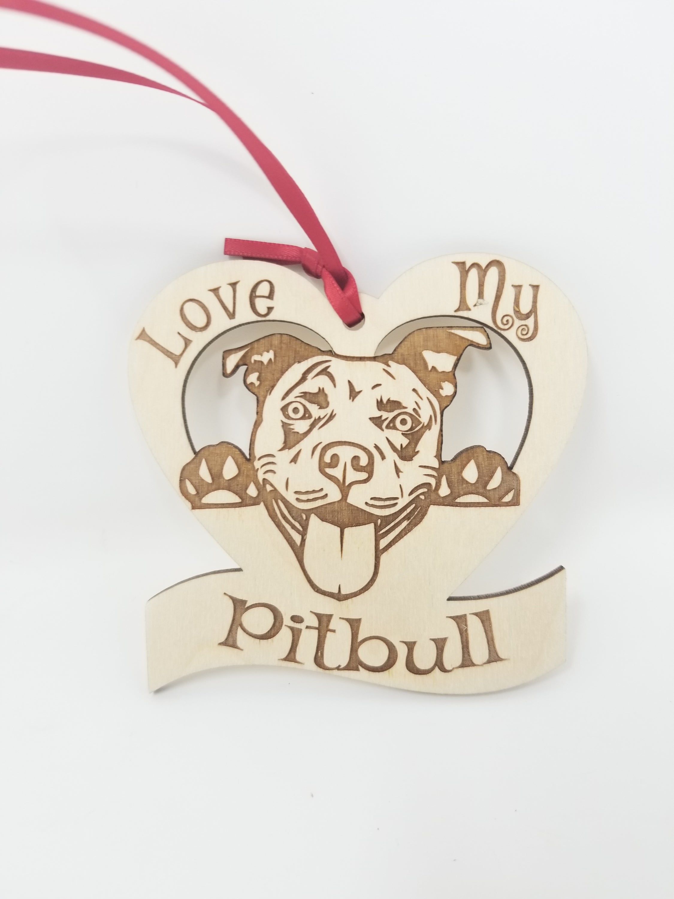 Love My Pitbull ornament made of laser engraved Baltic Birch wood, featuring a unique design and ribbon for hanging.