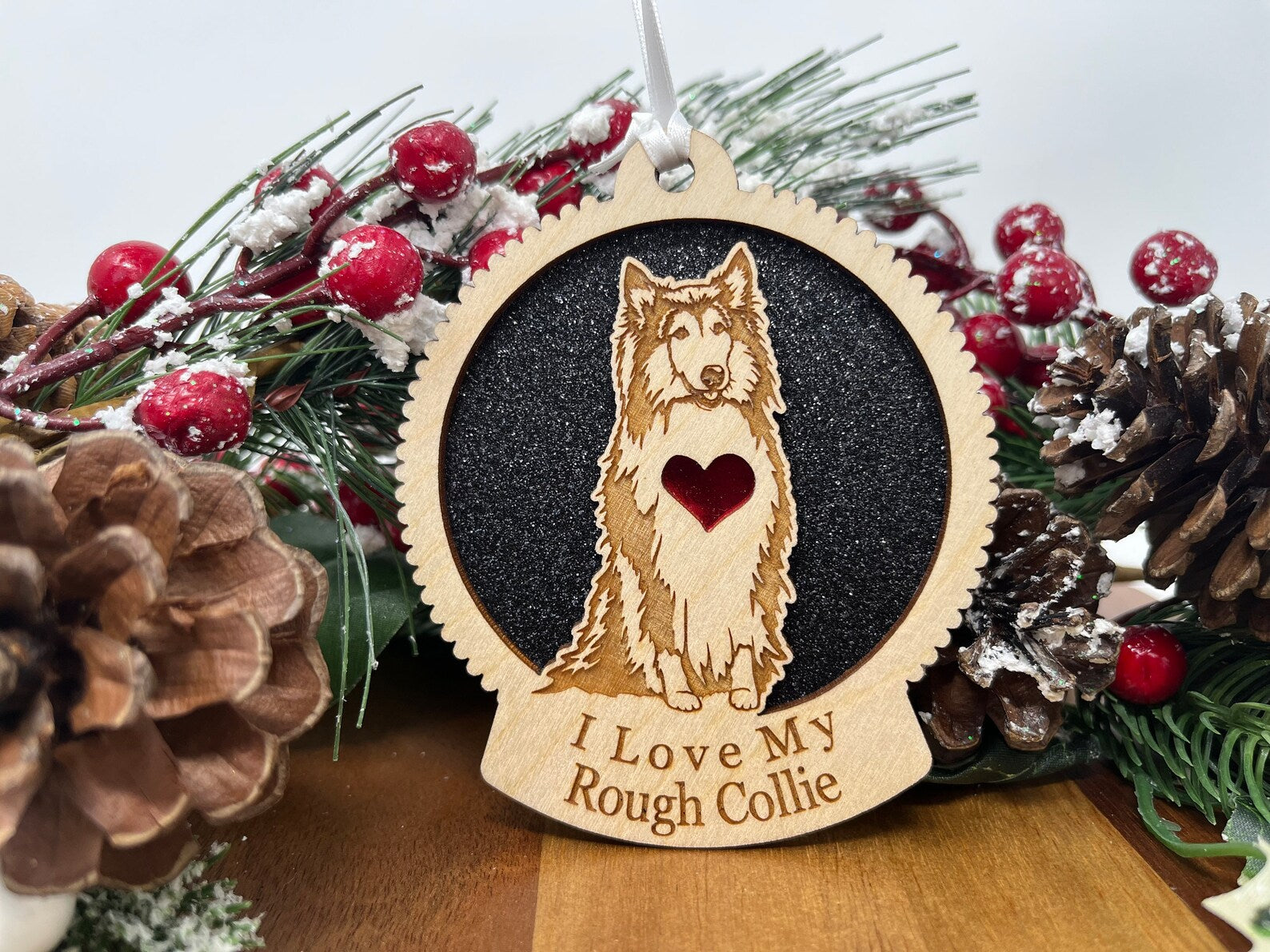 A beautifully crafted wooden ornament featuring a Rough Collie silhouette, perfect for Christmas decoration.