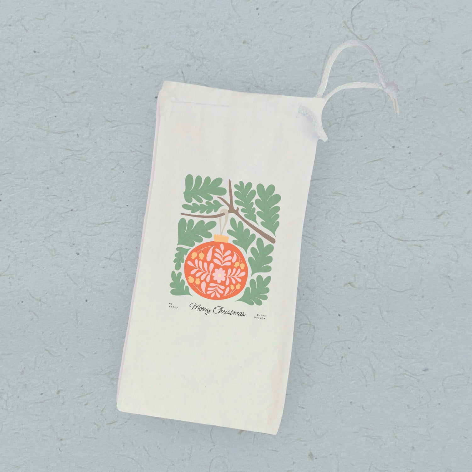 Merry Christmas Ornament canvas wine bag featuring a festive design and drawstring closure, perfect for gifting wine.