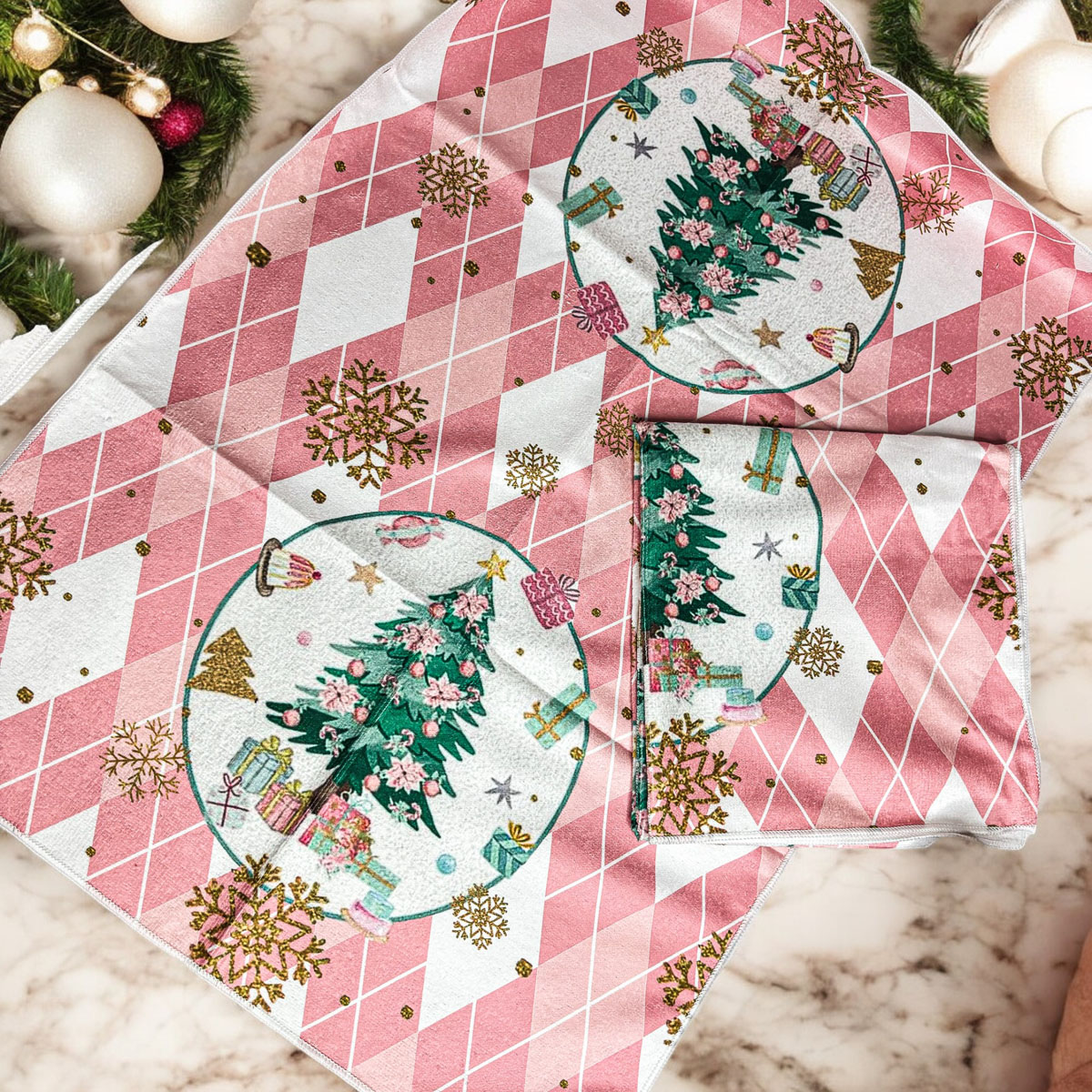 A soft and absorbent Pink Christmas Hand Towel featuring festive designs, perfect for holiday kitchen decor.