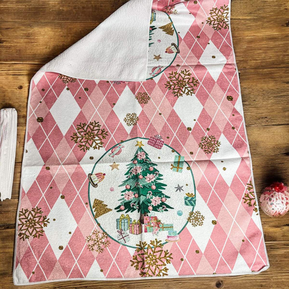 A soft and absorbent Pink Christmas Hand Towel featuring festive designs, perfect for holiday kitchen decor.
