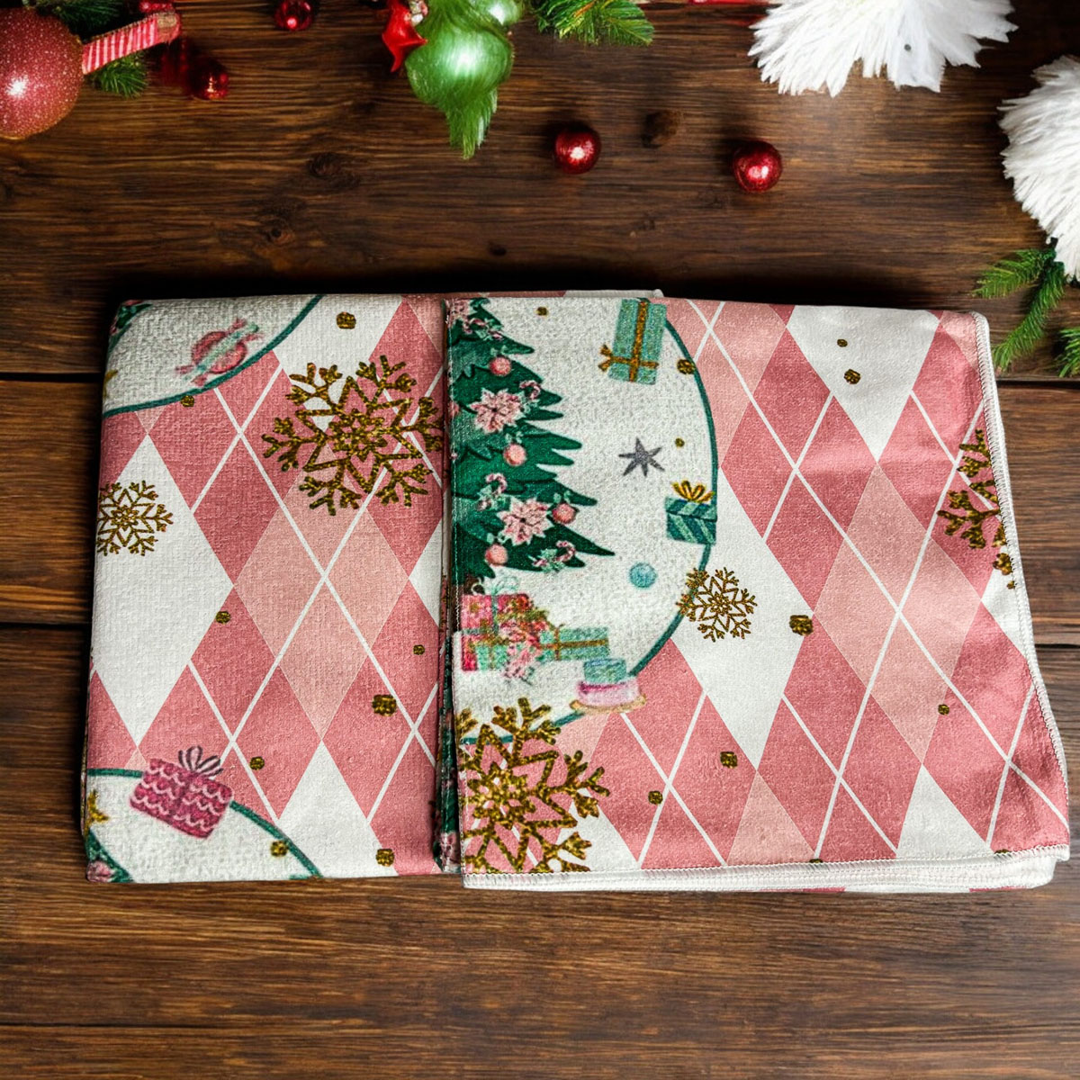 A soft and absorbent Pink Christmas Hand Towel featuring festive designs, perfect for holiday kitchen decor.