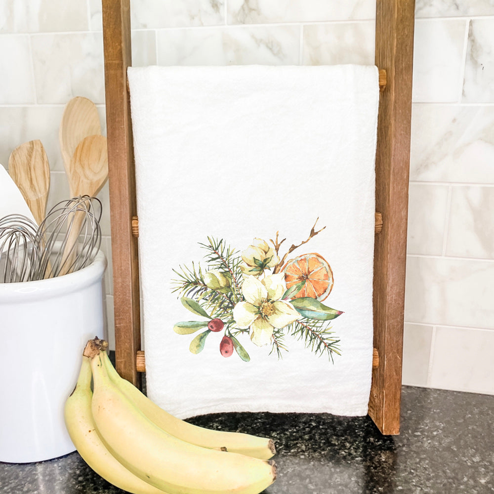 A vibrant cotton tea towel featuring a Poinsettia Holly and Orange Bouquet design, perfect for festive kitchen decor.