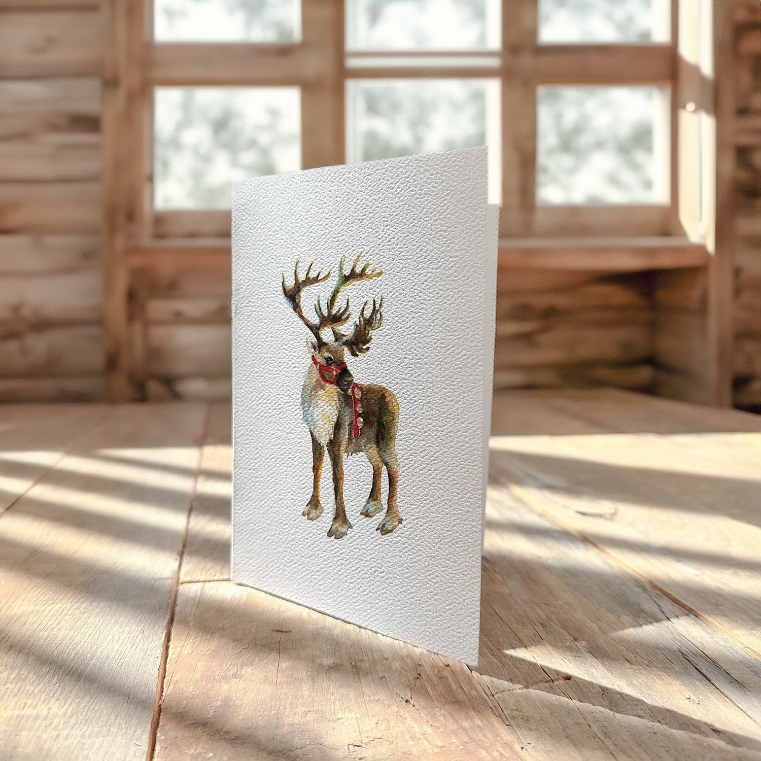 Santa's Reindeer greeting card featuring festive design on high-quality cardstock with envelope.