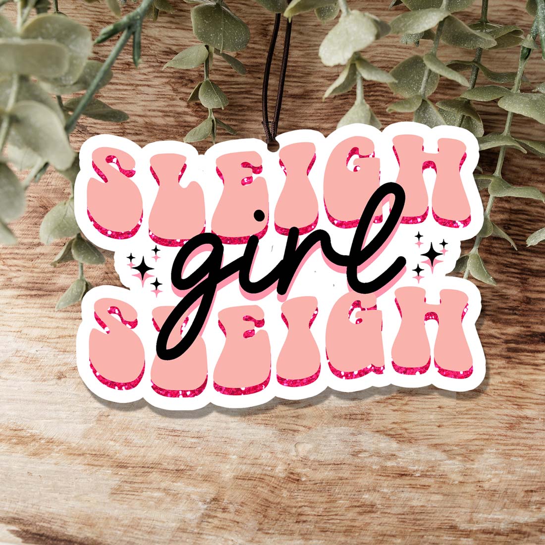 Sleigh Girl Freshie hanging air freshener with festive design and vibrant colors, perfect for holiday decor.