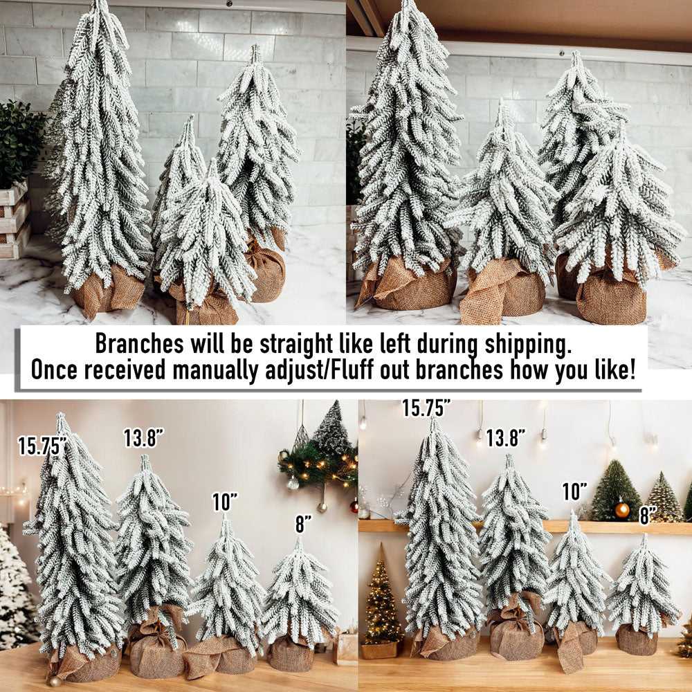 A set of four snow-covered Christmas trees in varying sizes, featuring a jute-covered wooden base, perfect for holiday decor.