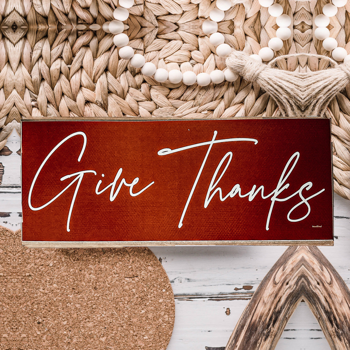 Two rustic wooden signs with 'Give Thanks' and 'Thankful' in elegant script, perfect for home decor.