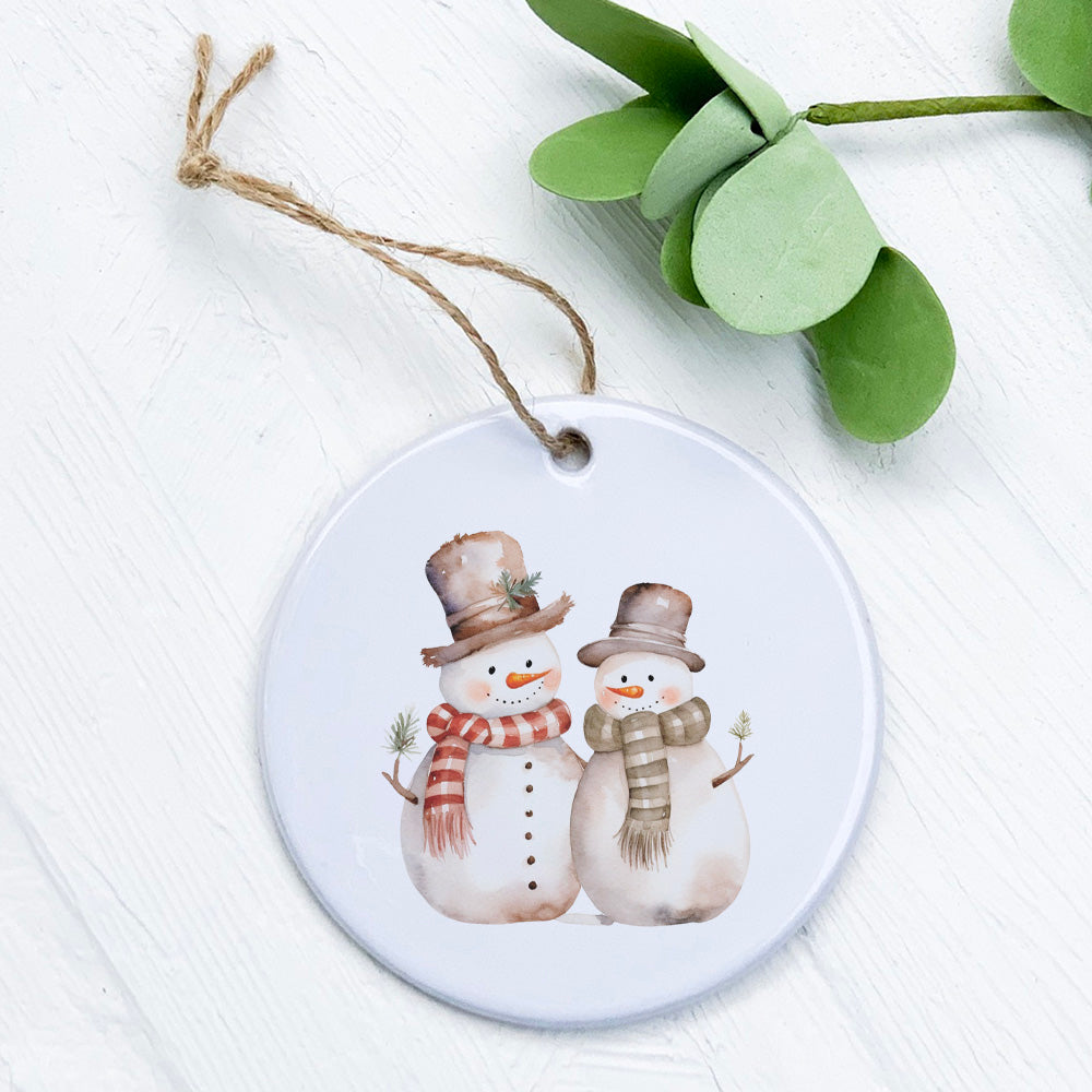 Two Snowmen ornament made of high-quality porcelain, featuring a vibrant design perfect for holiday decor.