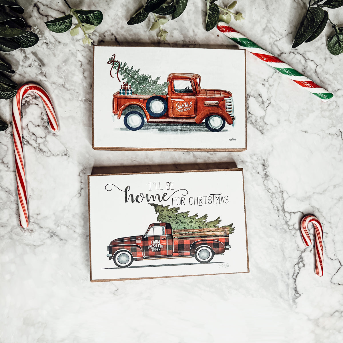 A charming Vintage Red Truck Sign featuring a classic red pickup truck with a Christmas tree, perfect for holiday decor.
