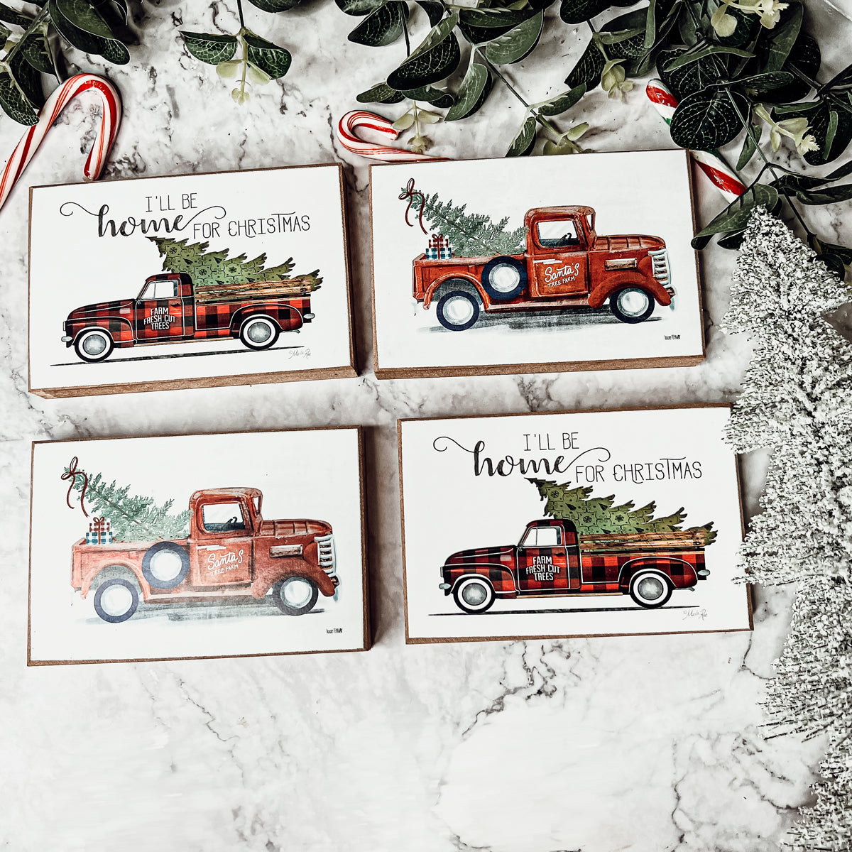 A charming Vintage Red Truck Sign featuring a classic red pickup truck with a Christmas tree, perfect for holiday decor.