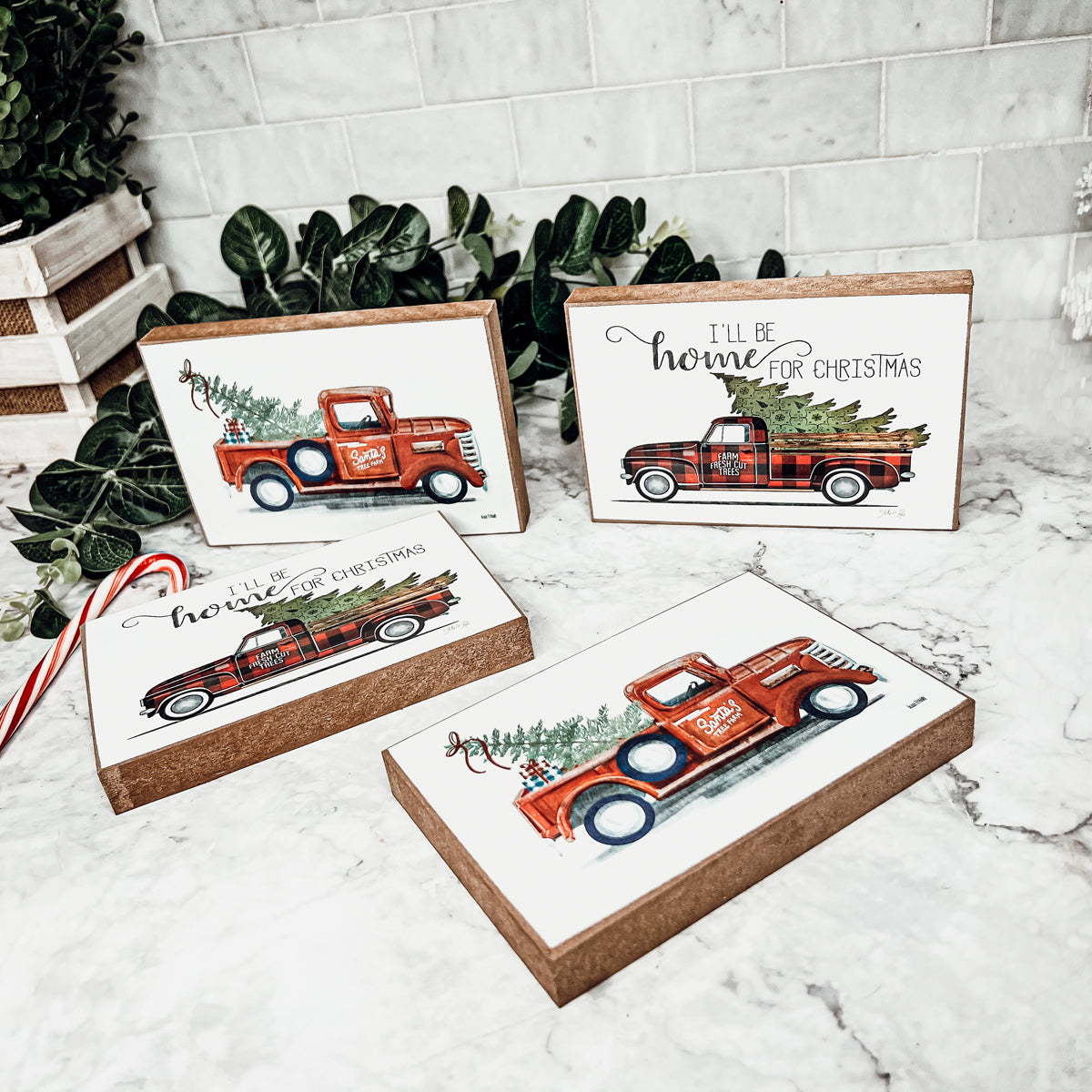 A charming Vintage Red Truck Sign featuring a classic red pickup truck with a Christmas tree, perfect for holiday decor.