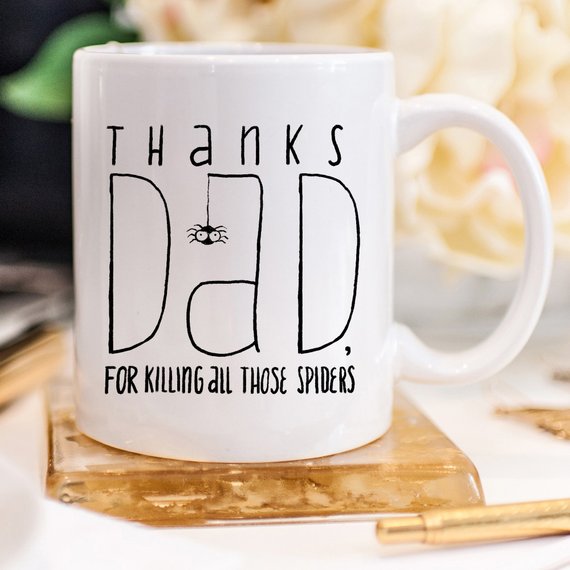 A white ceramic mug featuring a funny design, perfect for Father's Day gifts, showcasing vibrant colors and printed on both sides.
