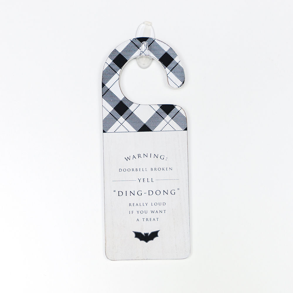 A double-sided Halloween door knob sign featuring 'Ding Dong' on one side and a spooky design on the other, perfect for festive decor.