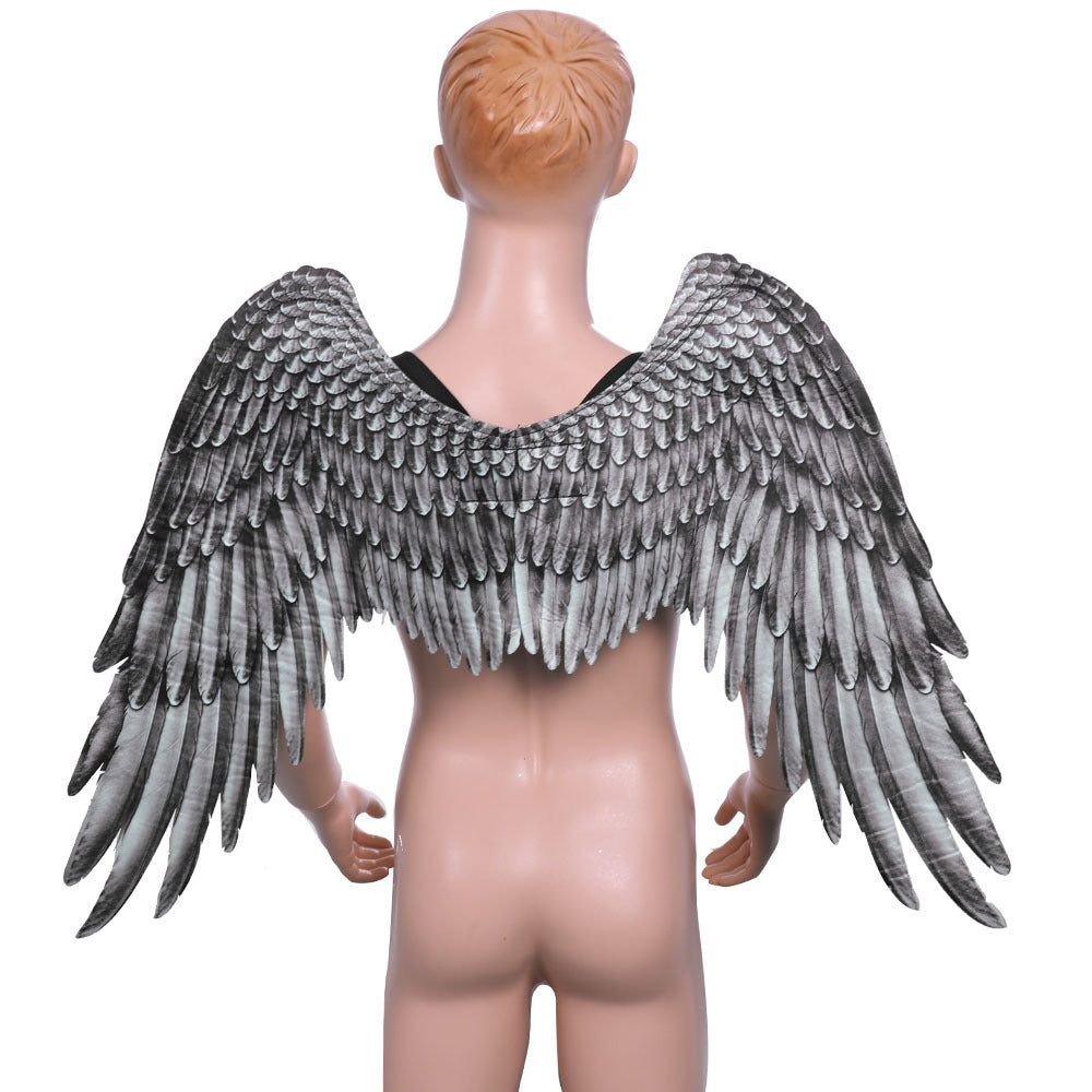 A pair of stunning Halloween Angel Wings designed for kids, featuring a vivid 3D design in white and black non-woven fabric, perfect for cosplay and dress-up parties.
