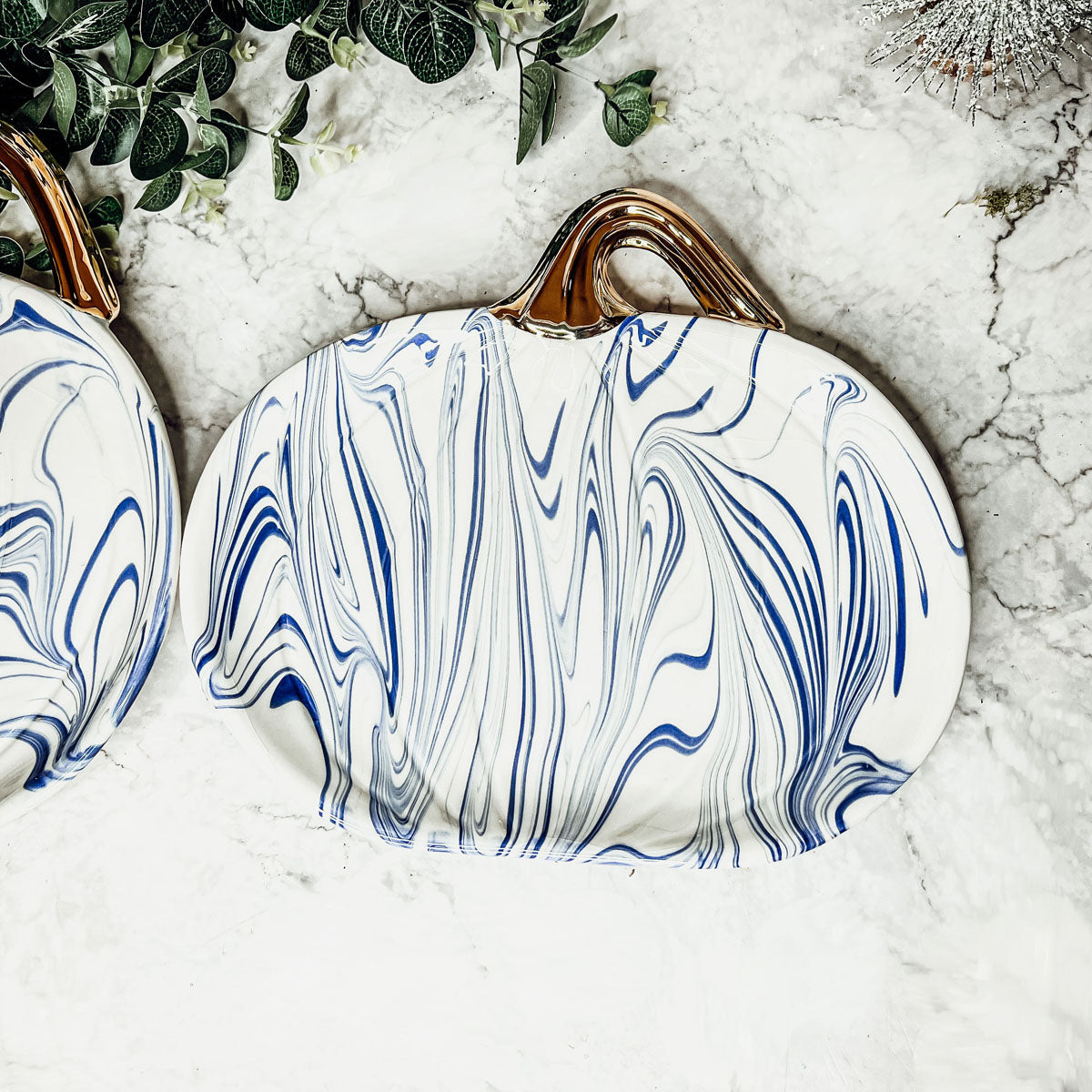 Martha Blue Pumpkin Plate set featuring marbled blue and white design with elegant gold stems, perfect for serving desserts.