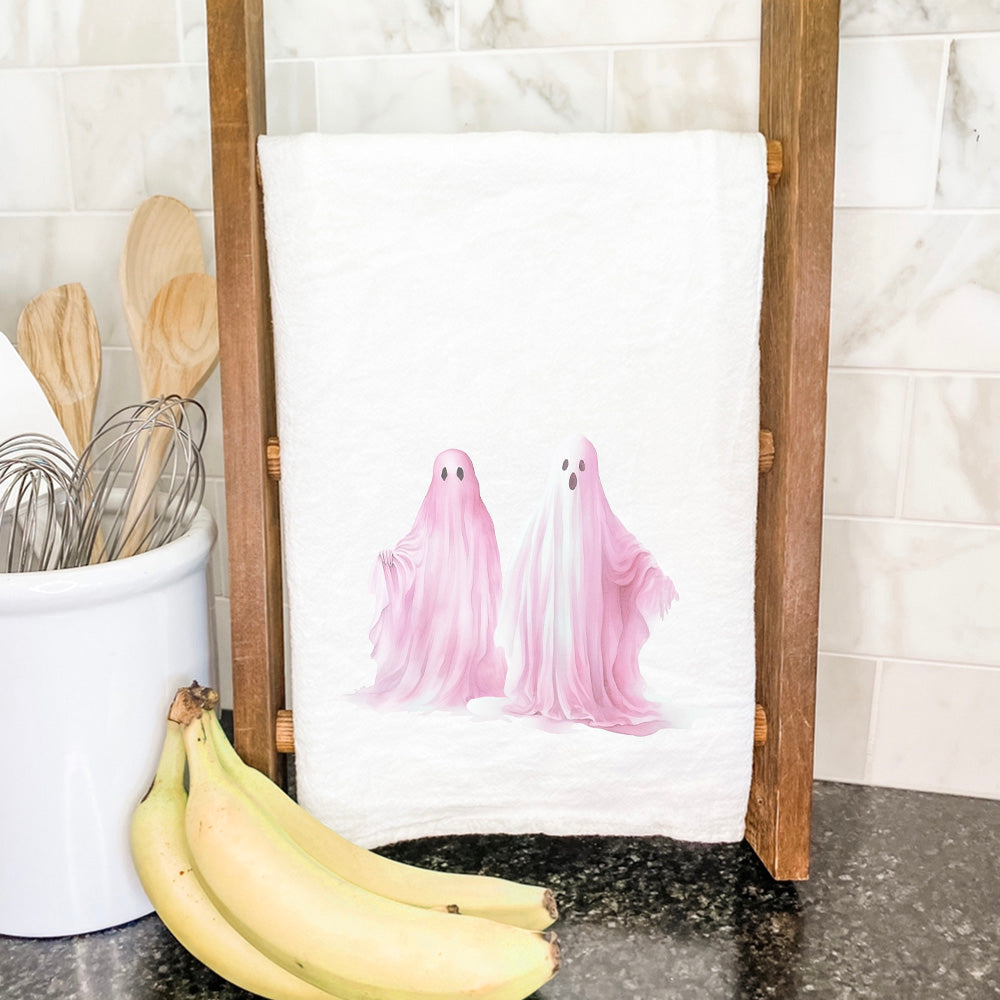 A vibrant Pink Ghosts Cotton Tea Towel featuring a unique design, made from 100% absorbent cotton, perfect for kitchen use.
