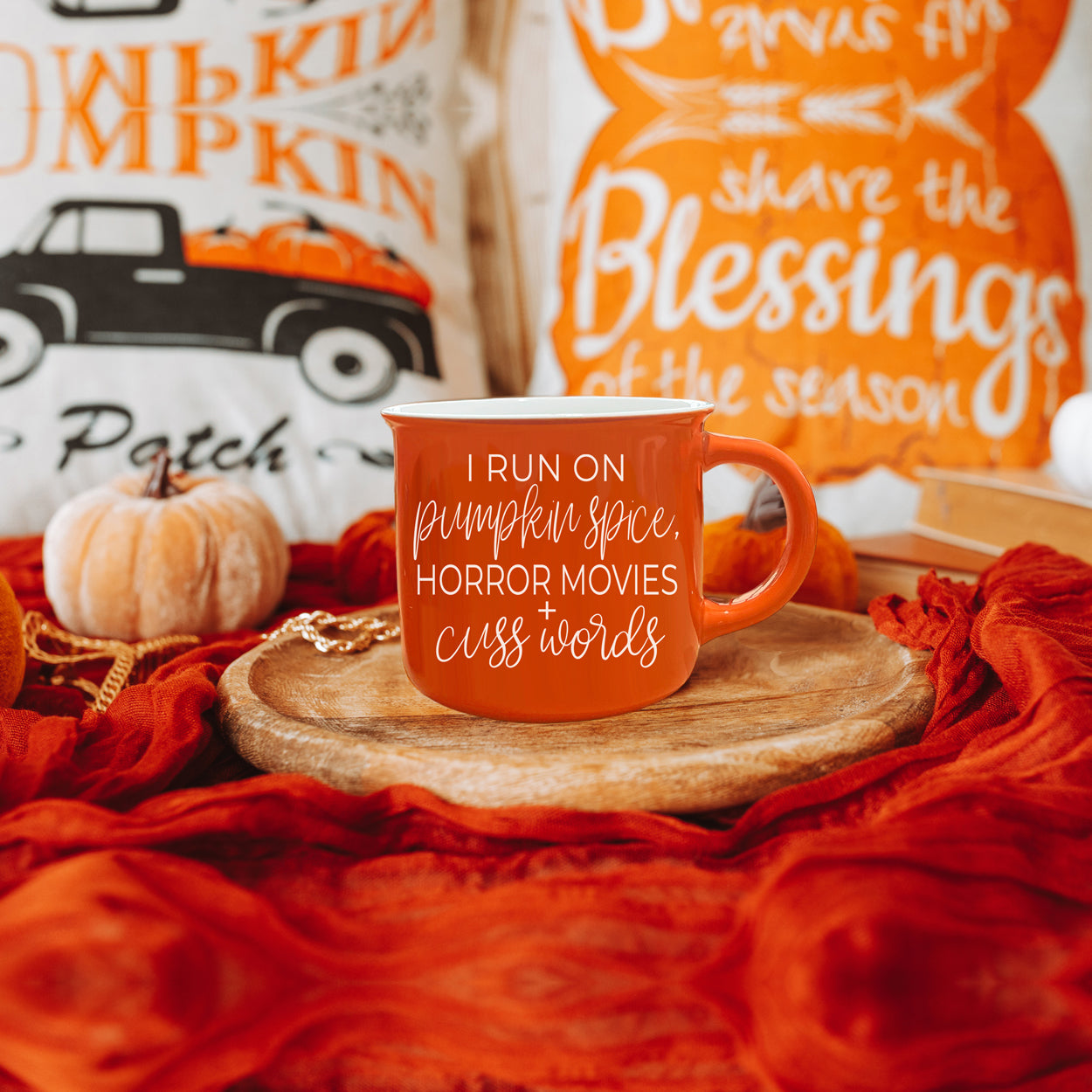 Pumpkin + Horror Mug featuring vibrant orange color and white lettering, perfect for fall and horror movie lovers.