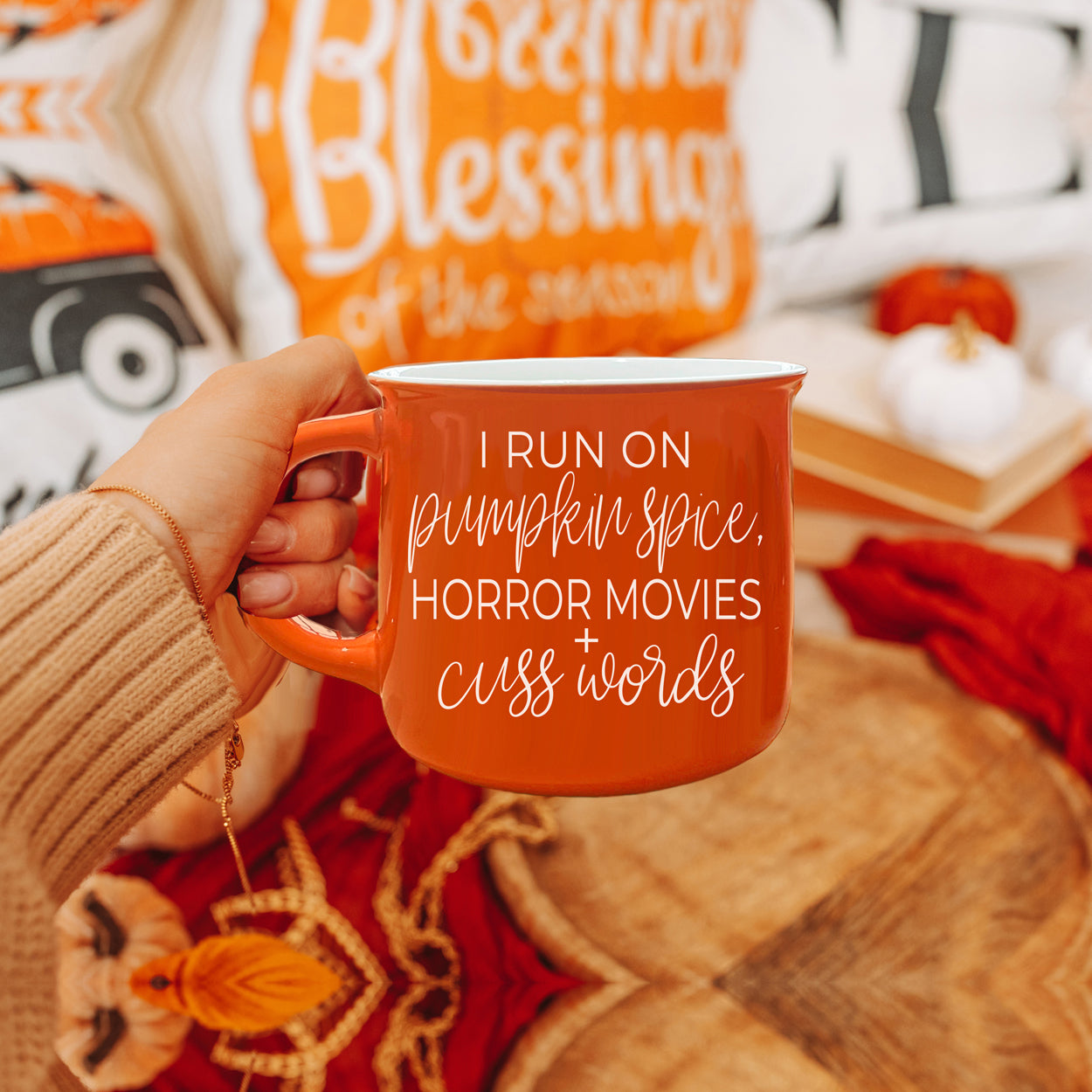 Pumpkin + Horror Mug featuring vibrant orange color and white lettering, perfect for fall and horror movie lovers.